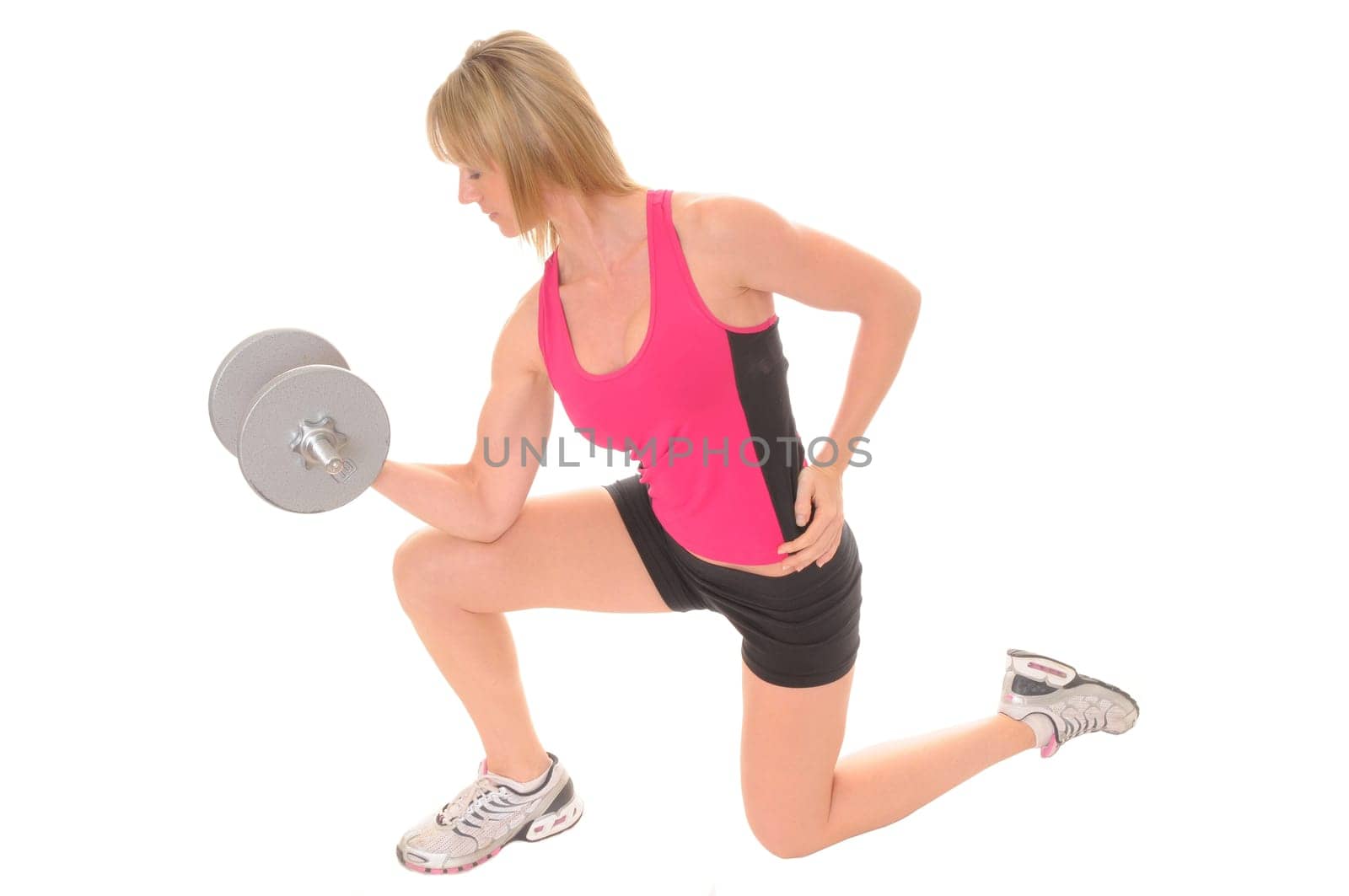 Beautiful young woman working out with weights