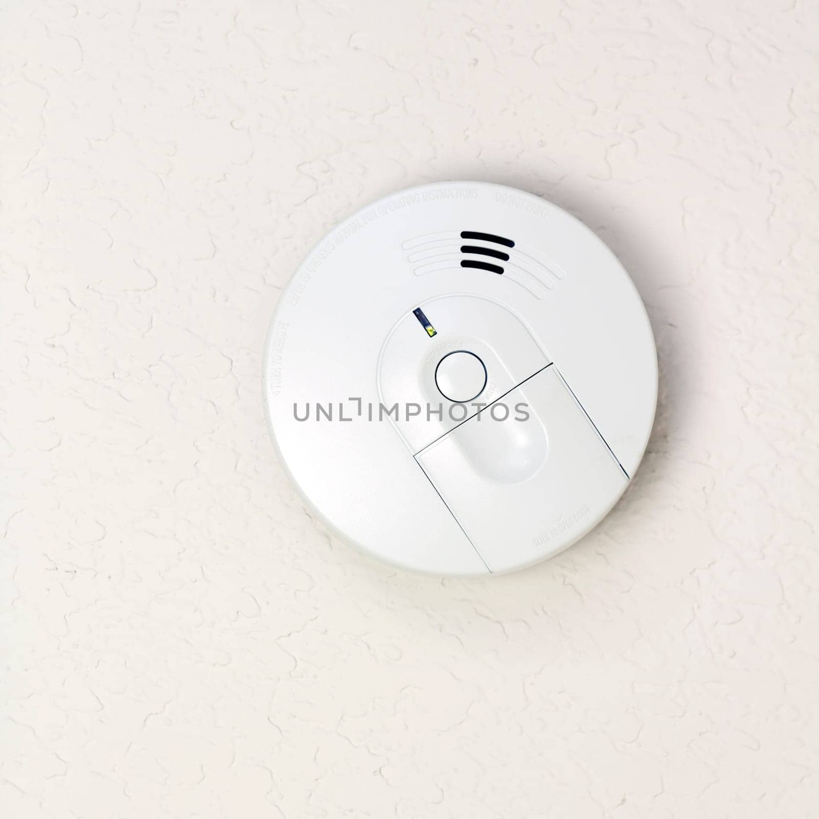 Small round battery operated device to warn residents of fire.