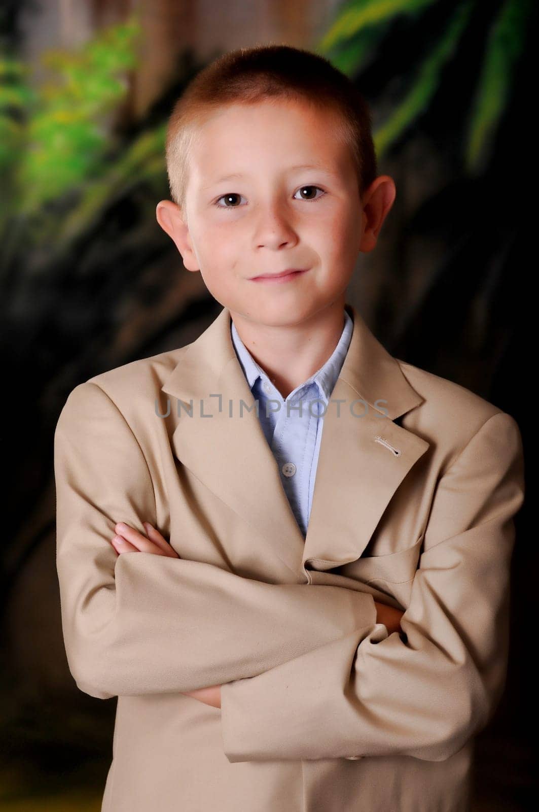 Young boy businessman dressed formally wearing a suit