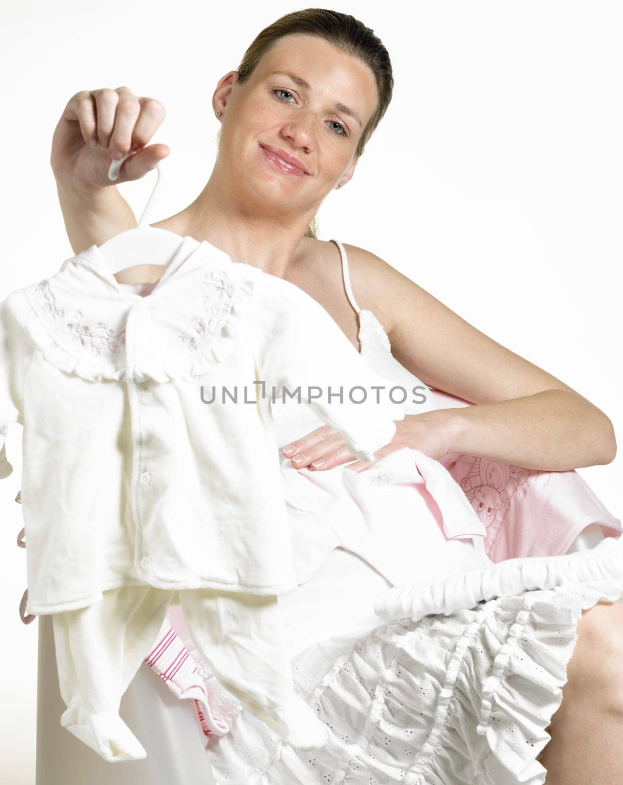 pregnat woman with clothes for babies