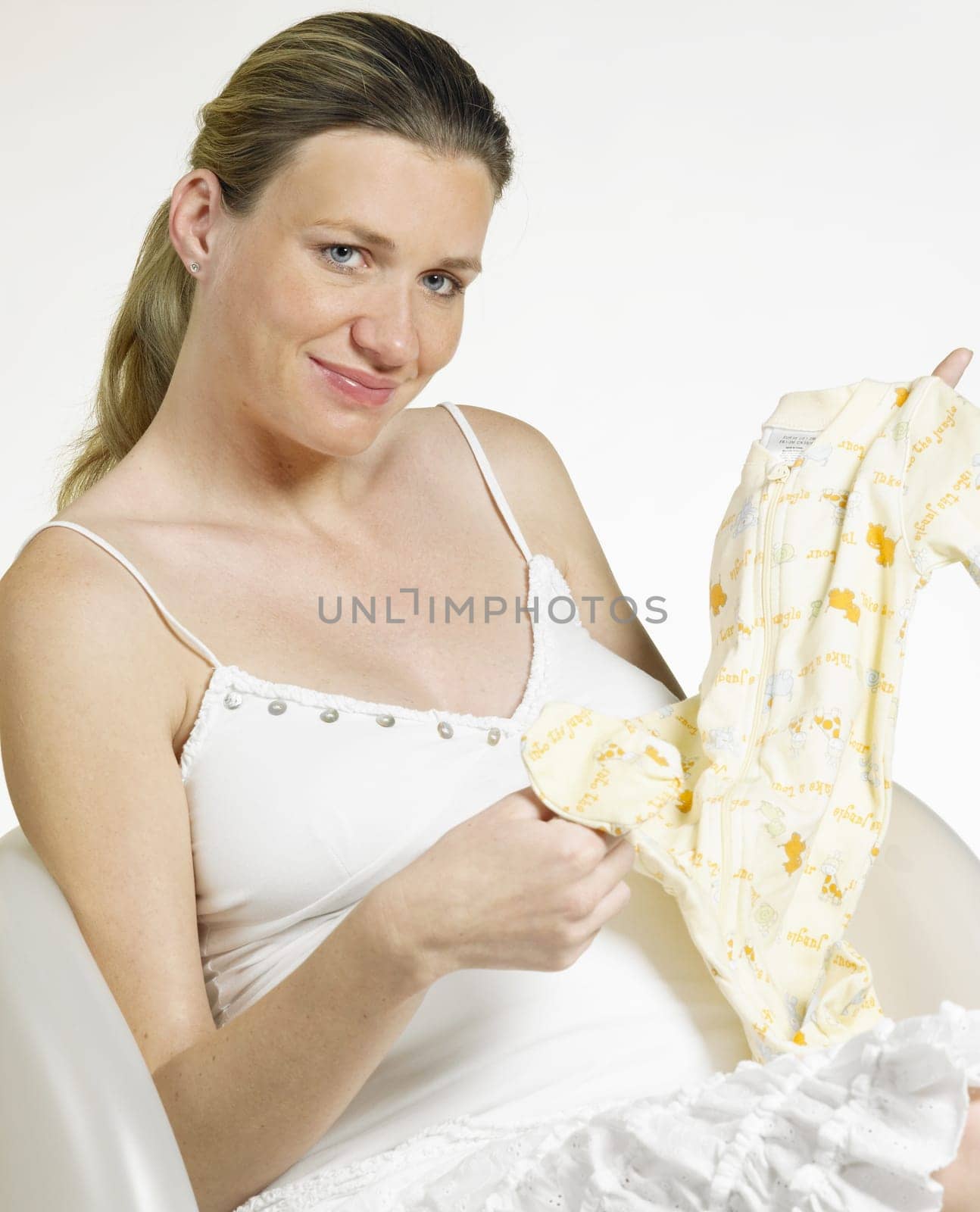 pregnat woman with clothes for babies