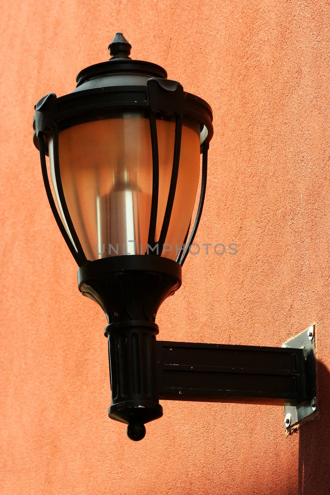 A Street light on the side of a building