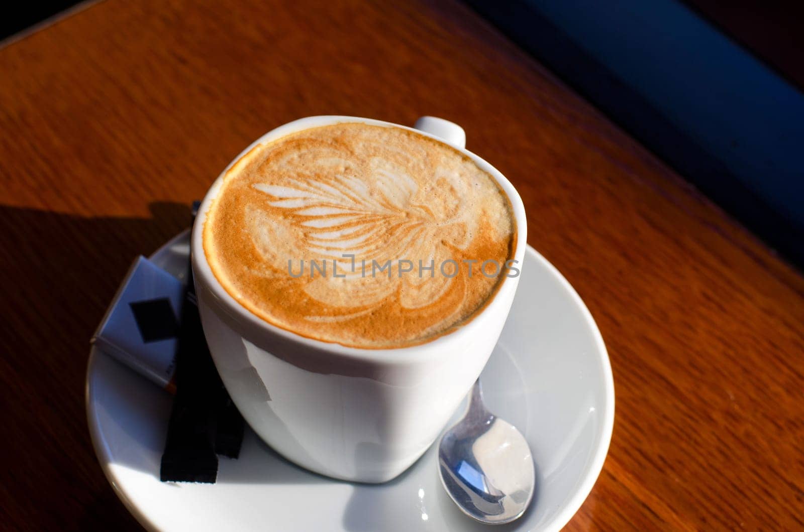 Cappuccino coffee cup closeup at the table