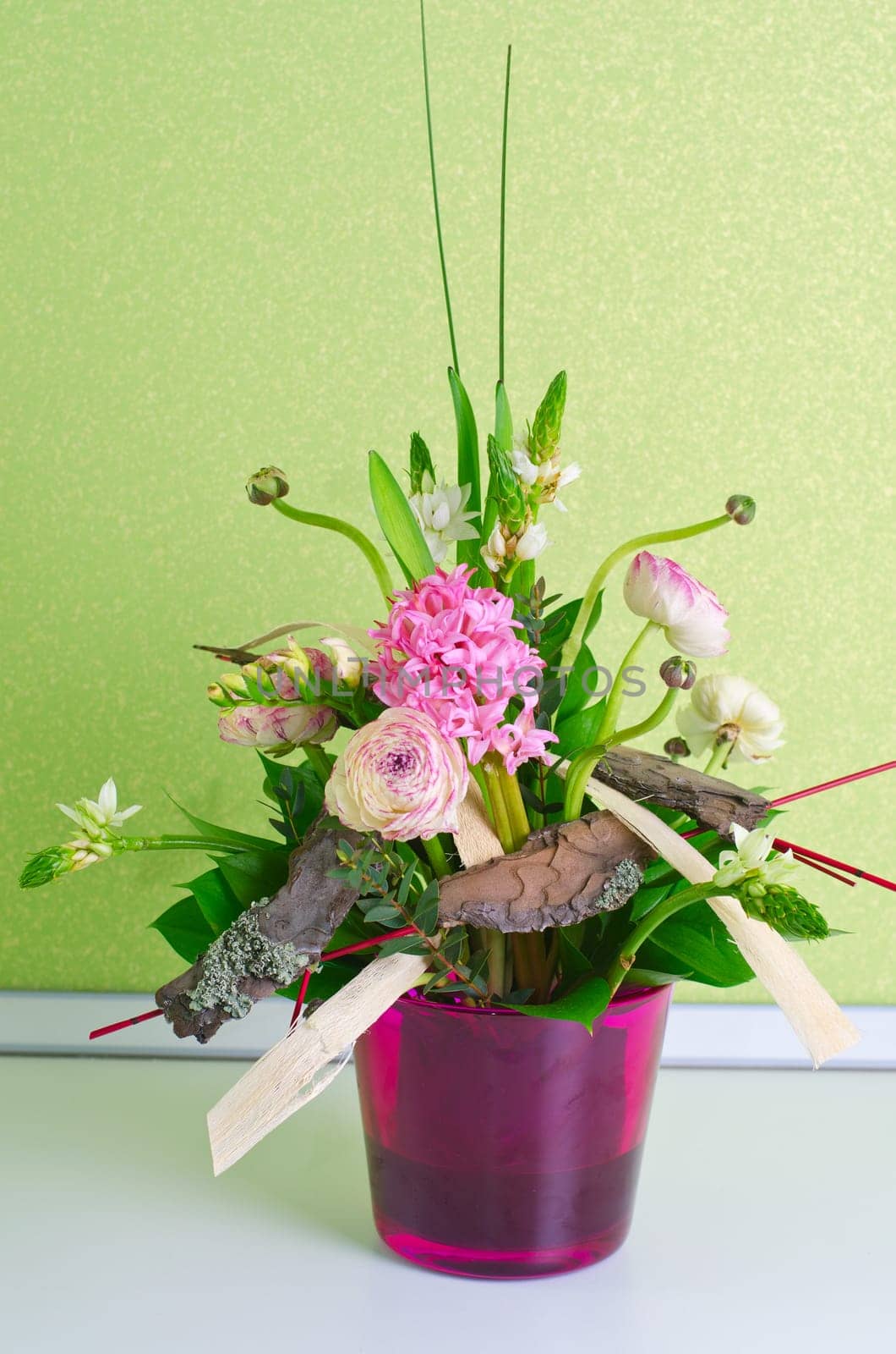 bunch of flowers composition at pot on a table