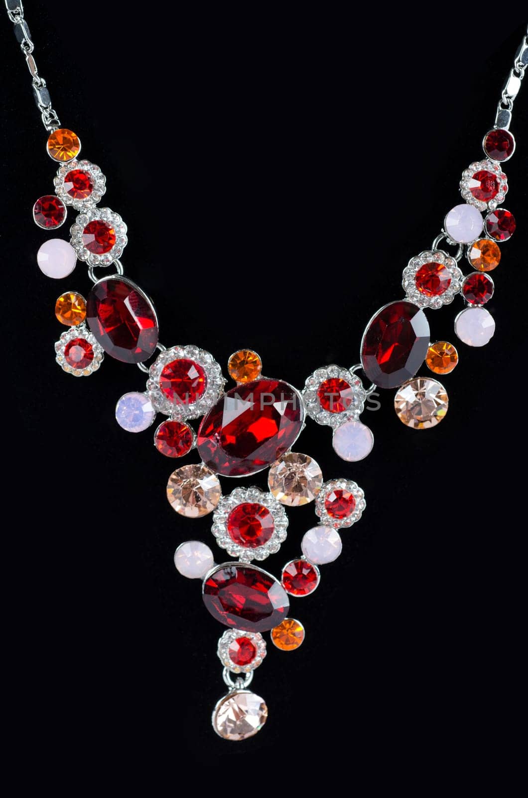 pendant closeup with big gem at black background