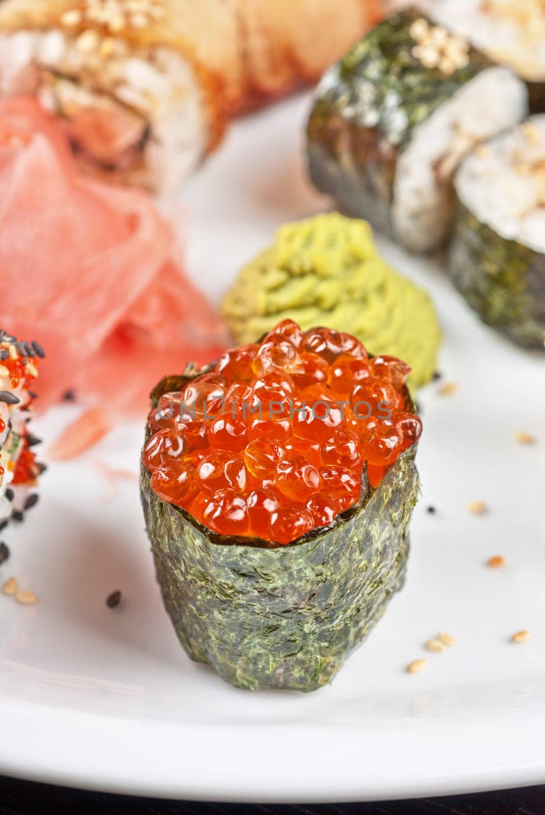 japanese sushi set with red caviar sushi in the foreground