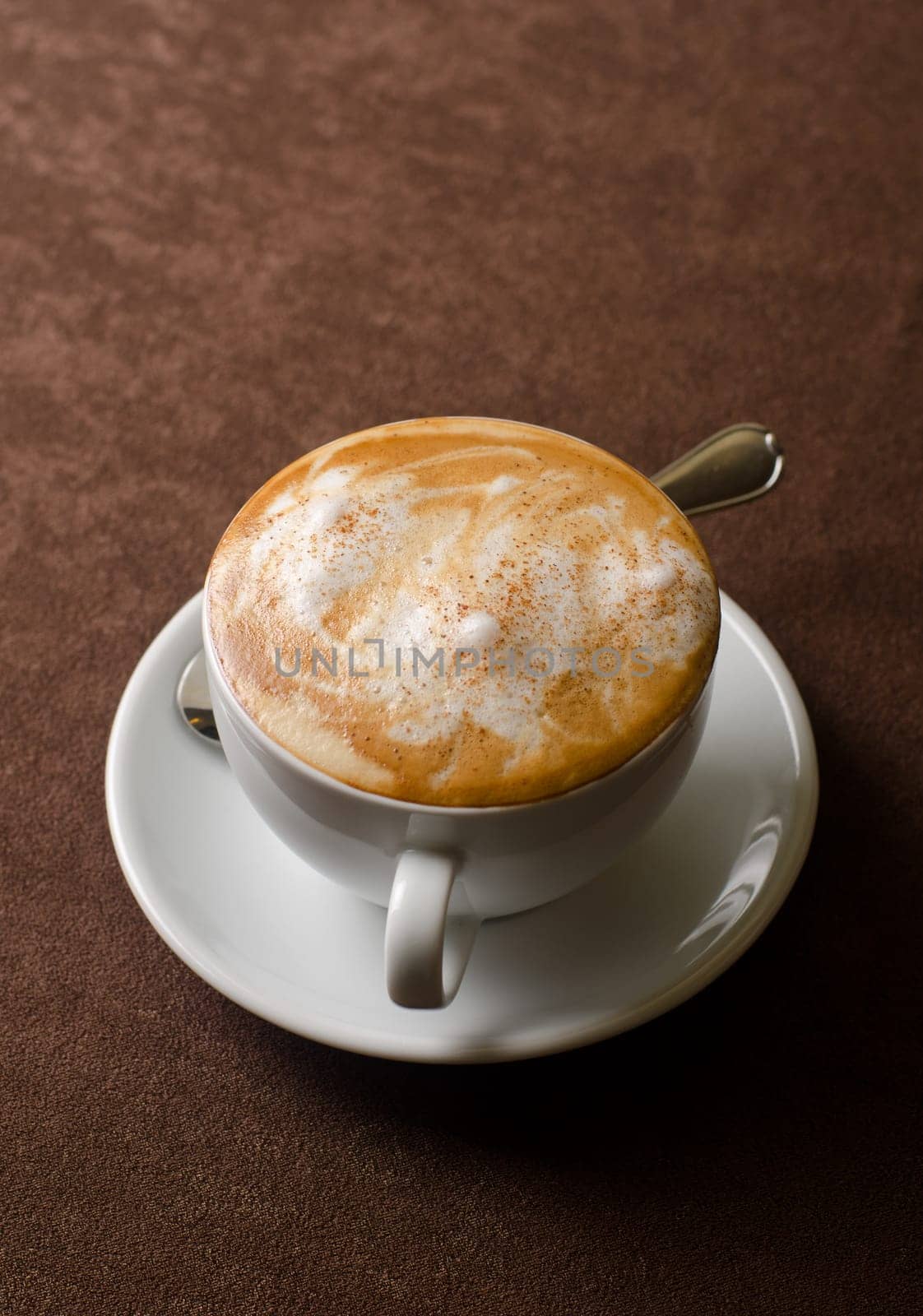 Cappuccino coffee cup closeup at the table