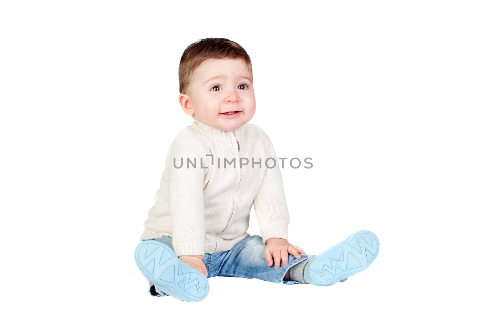 Beautiful baby sit on the floor isolated on white background