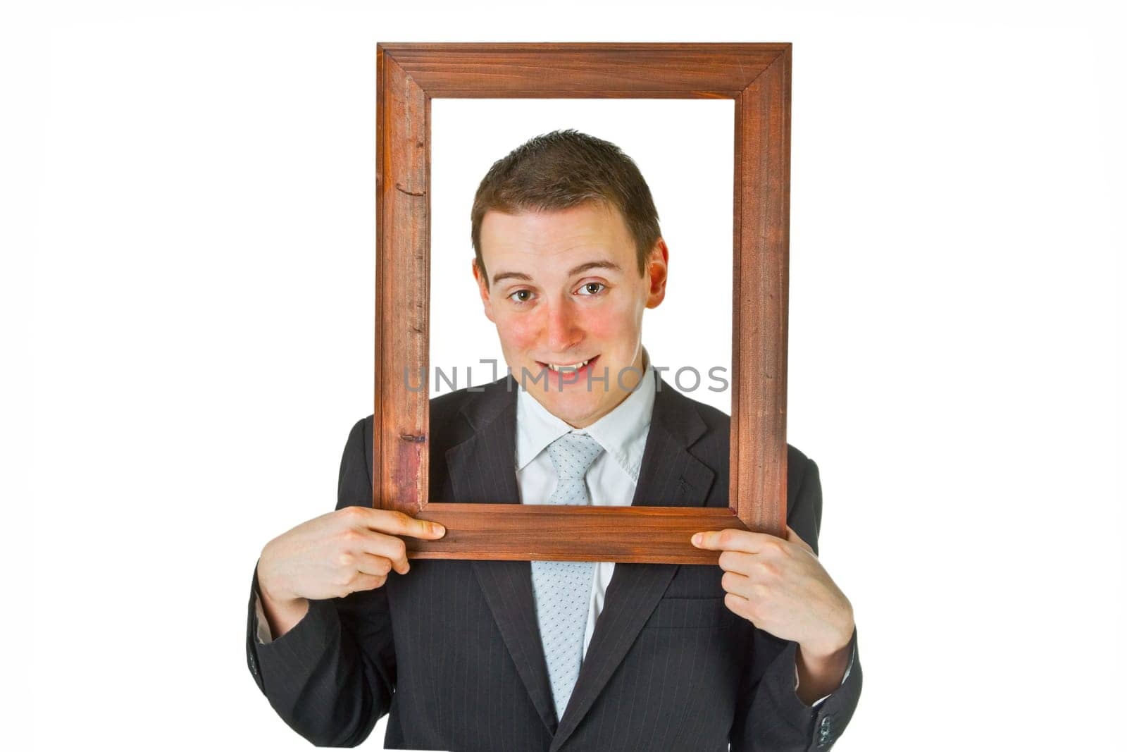 Friendly businessman with picture frame isolated on white background