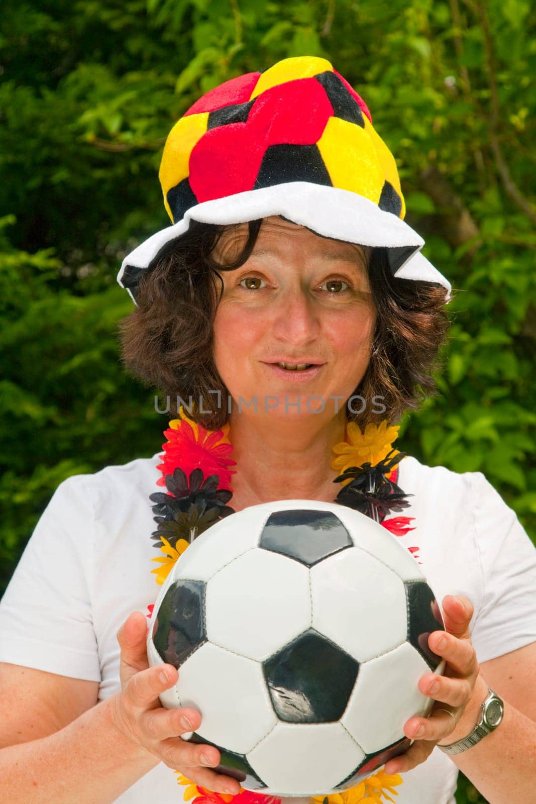 Female football fan with hat and Germany flag