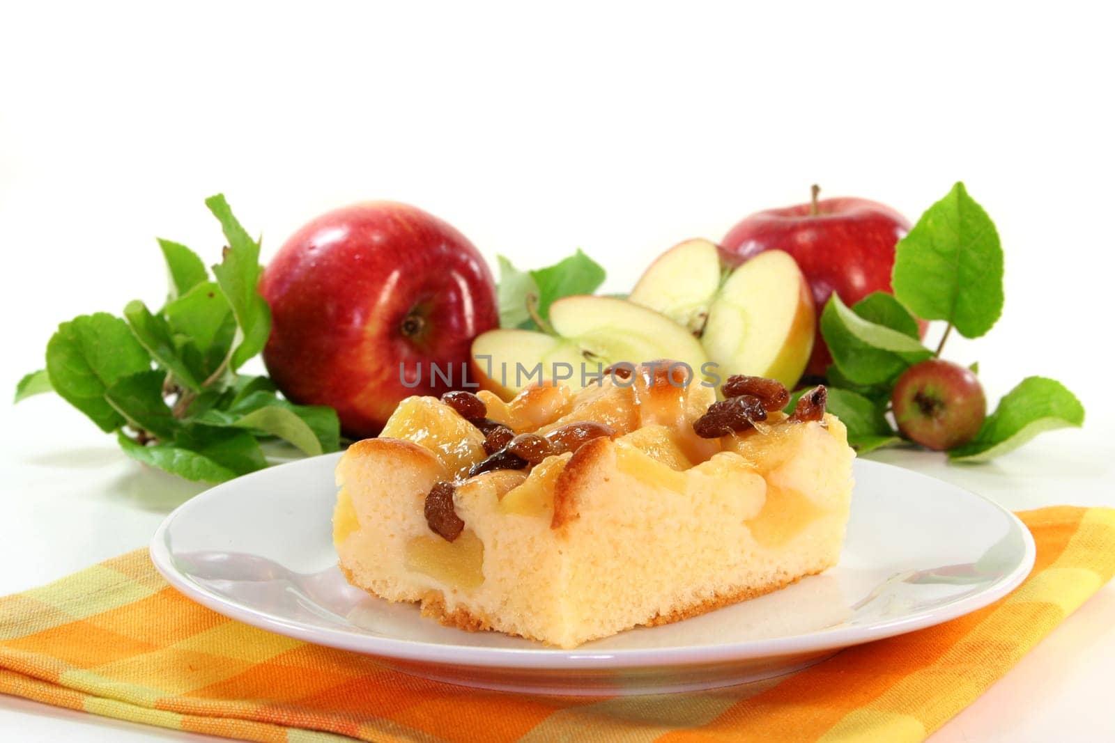 a piece of apple pie on a white plate