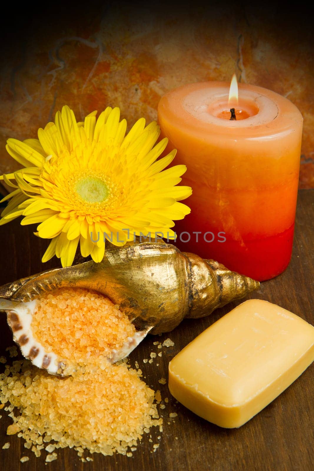Soap and  flowers on wooden table