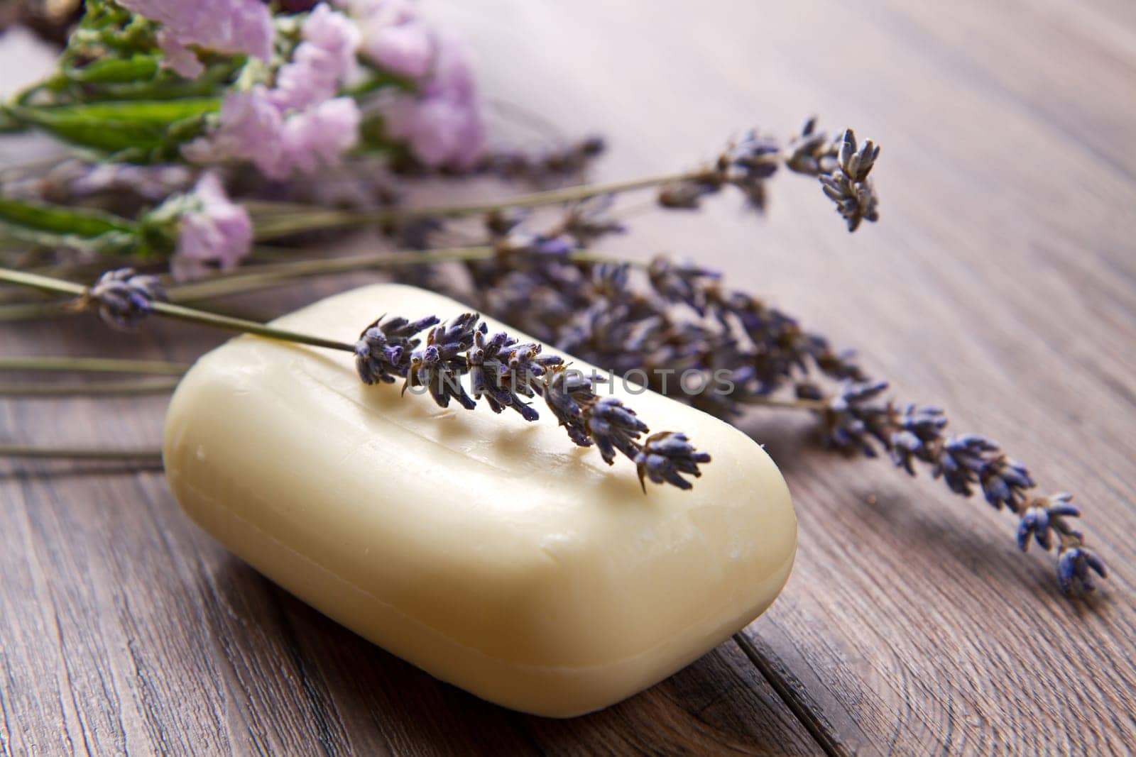 lanvander soap with flower on wooden background