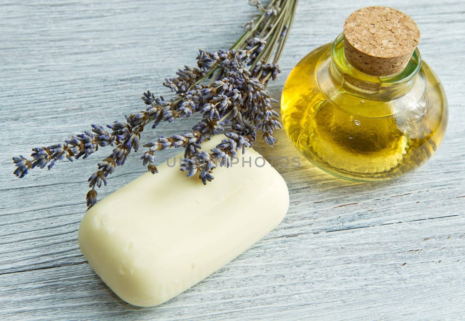 lanvander soap with flower on wooden background