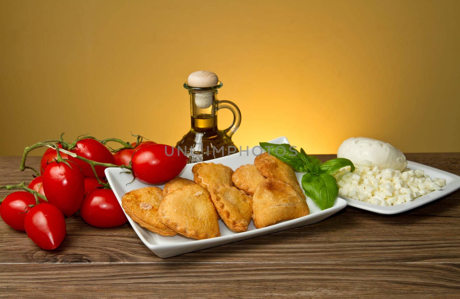 classic italian panzerotti with tomatoes and mozzarella