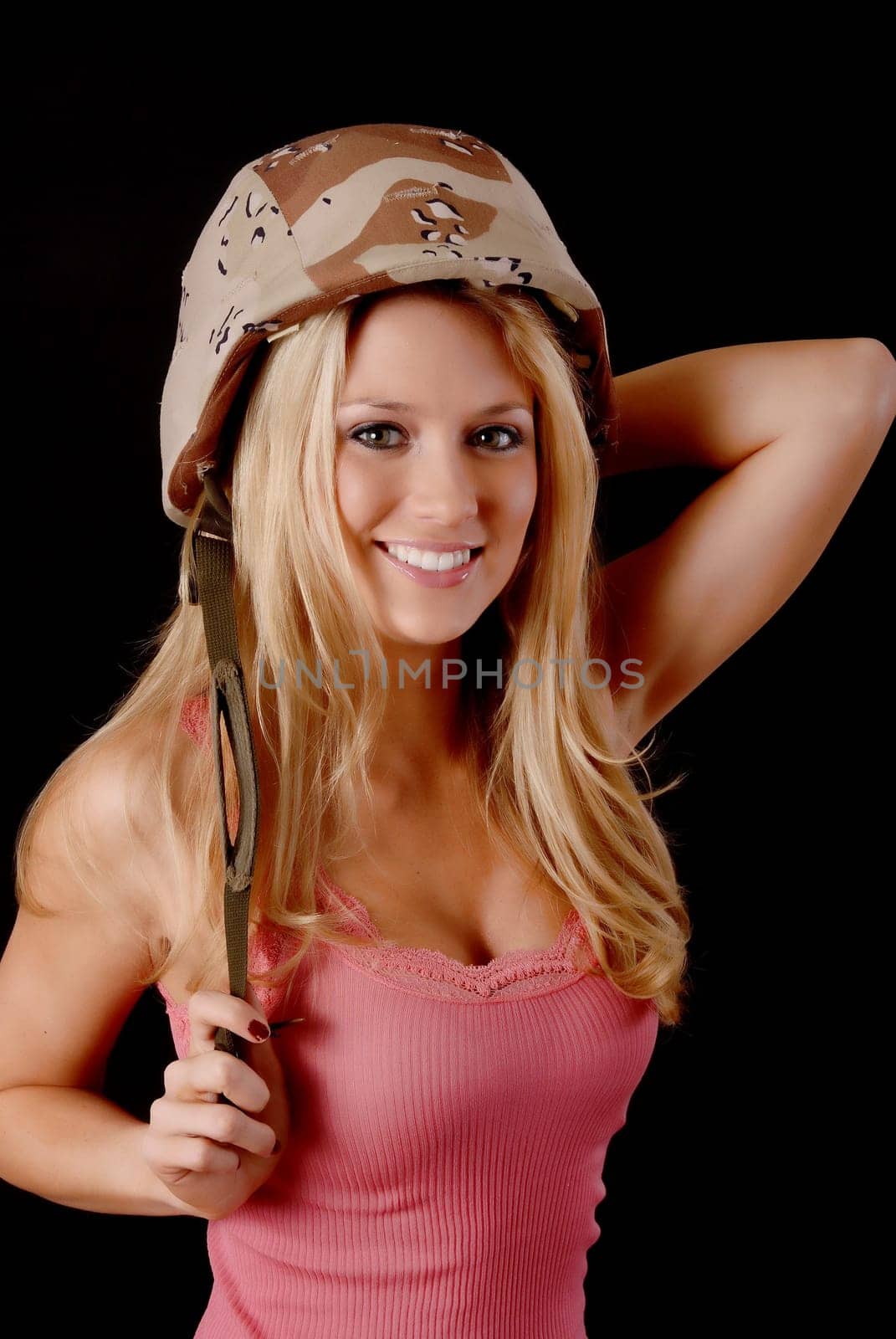 Isolated lovely and sexy young blond girl wearing a Army helmet