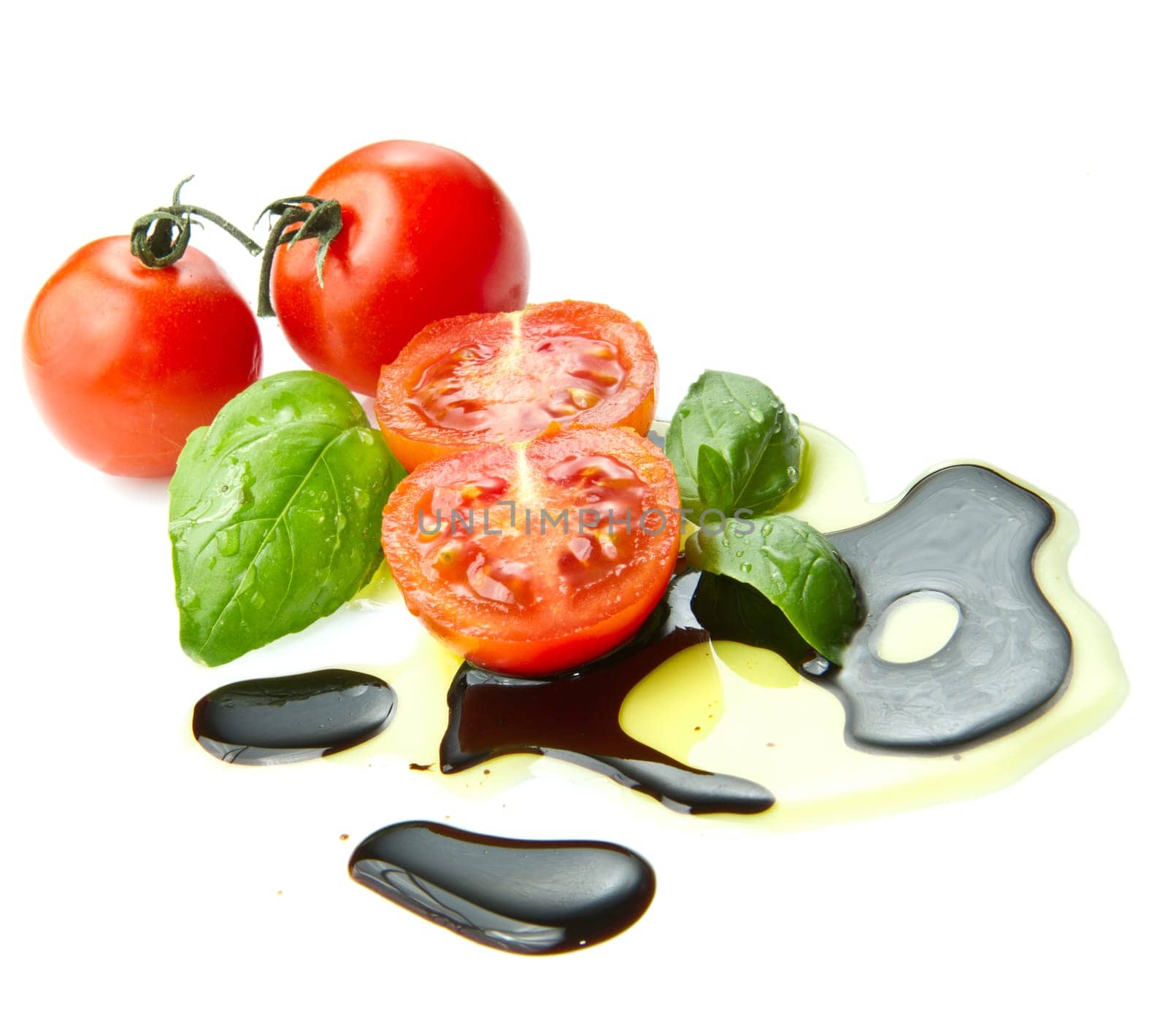 Fresh tomato and basil over olive oil and balsamic vinegar