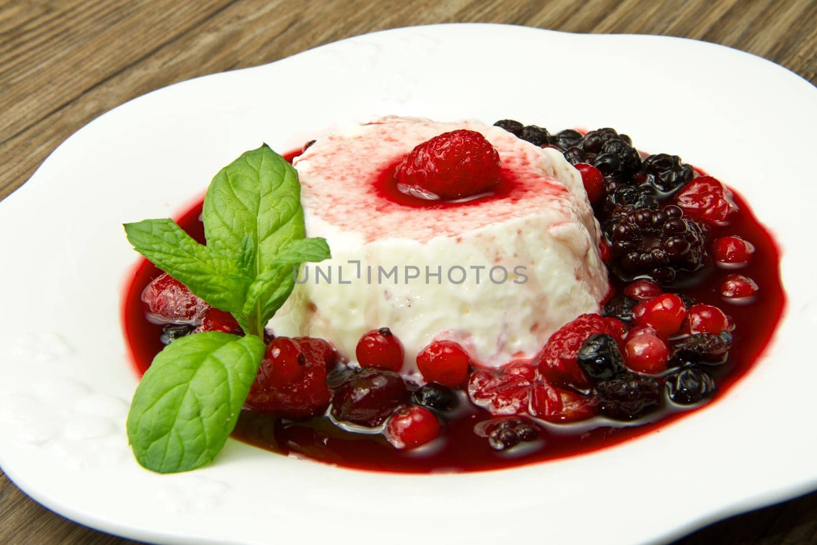 italian panna cotta dessert with fresh berries