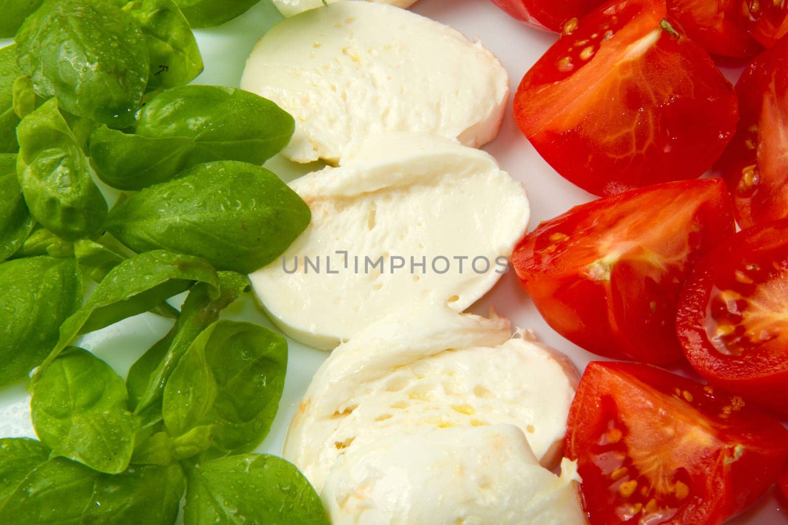 Italian flag made wit Tomato Mozzarella and Basil