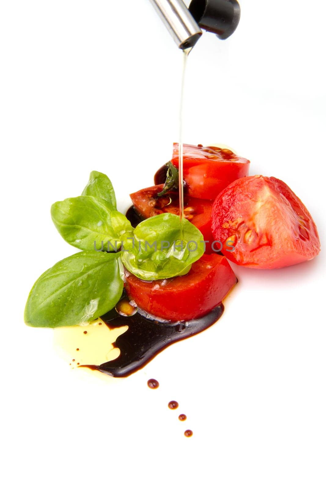 Fresh tomato and basil over olive oil and balsamic vinegar