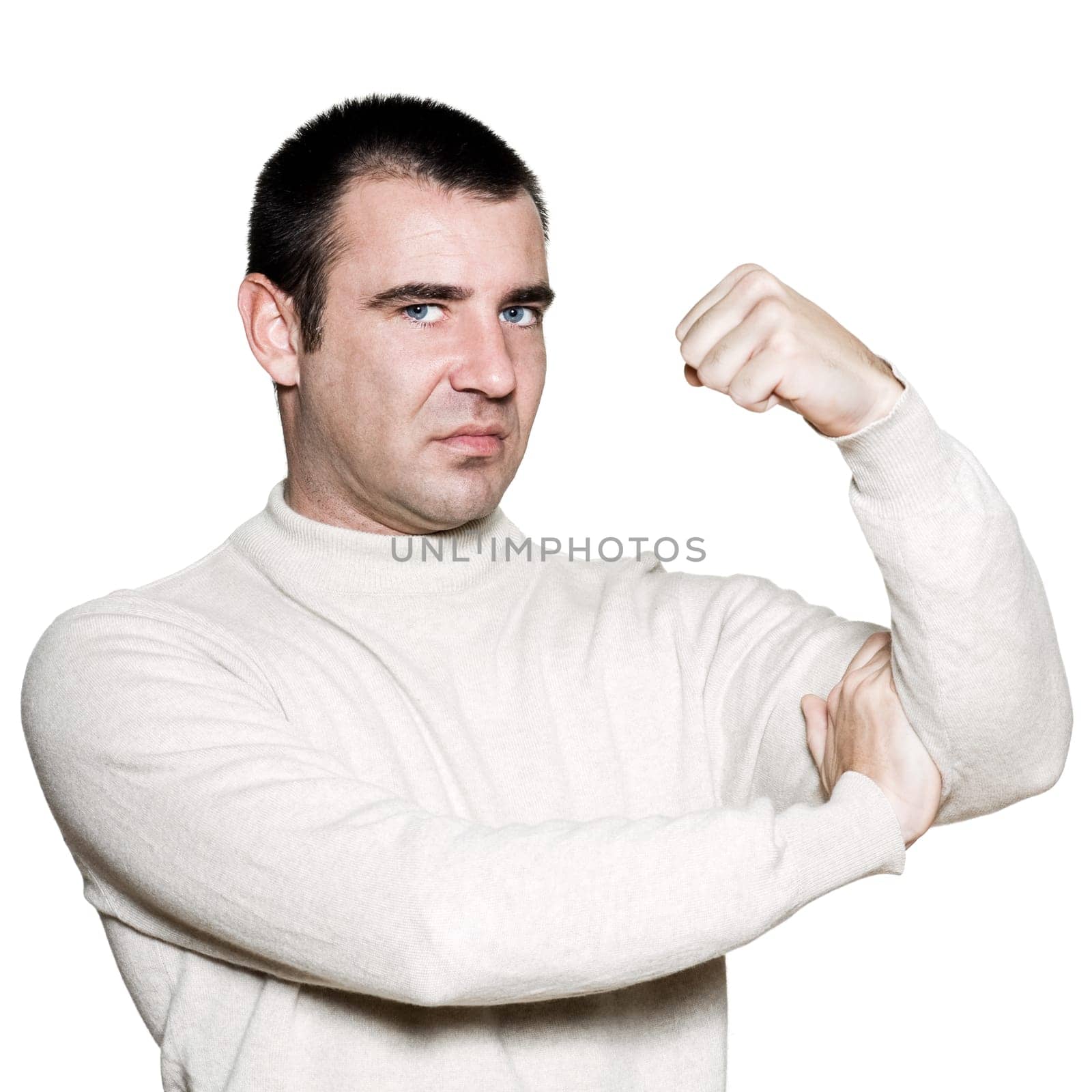 Portrait of a unhappy man flexing biceps in studio on white isolated background