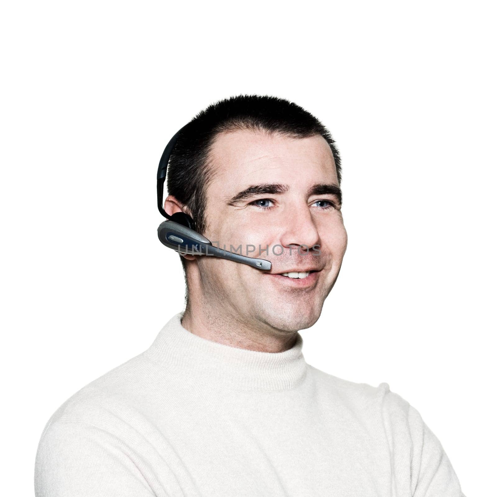 Portrait of a handsome expressive friendly man with headset in studio on white isolated background