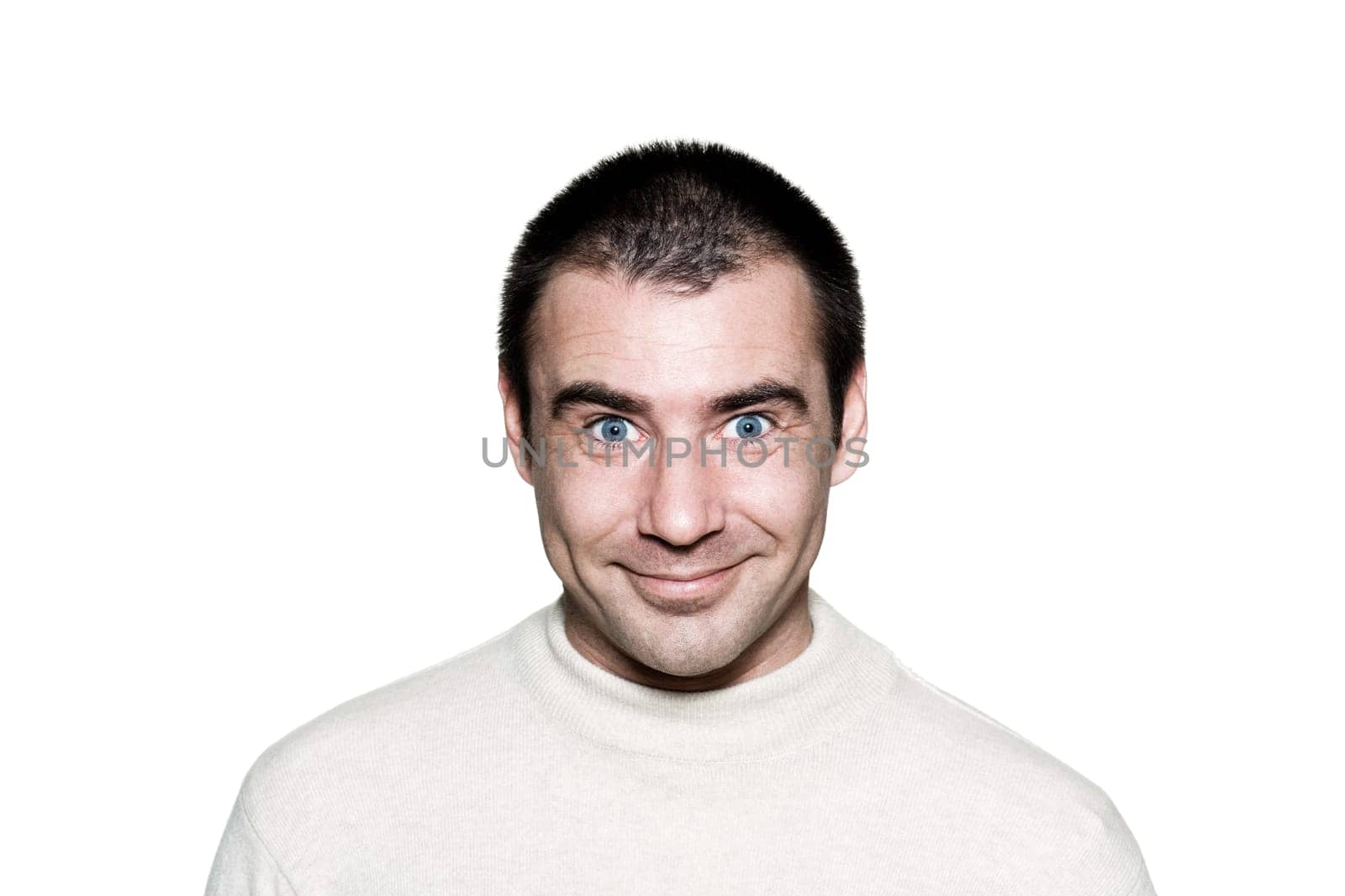 Portrait of a handsome expressive man making funny face in studio on white isolated background