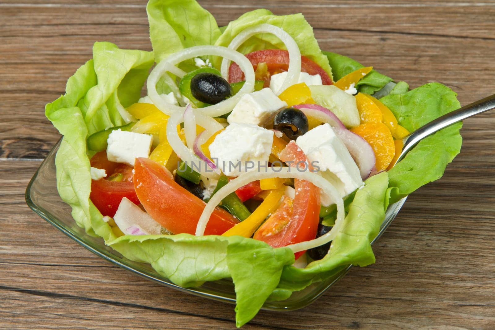Feta salad with tomatoes, black olives  and fresh vegetables