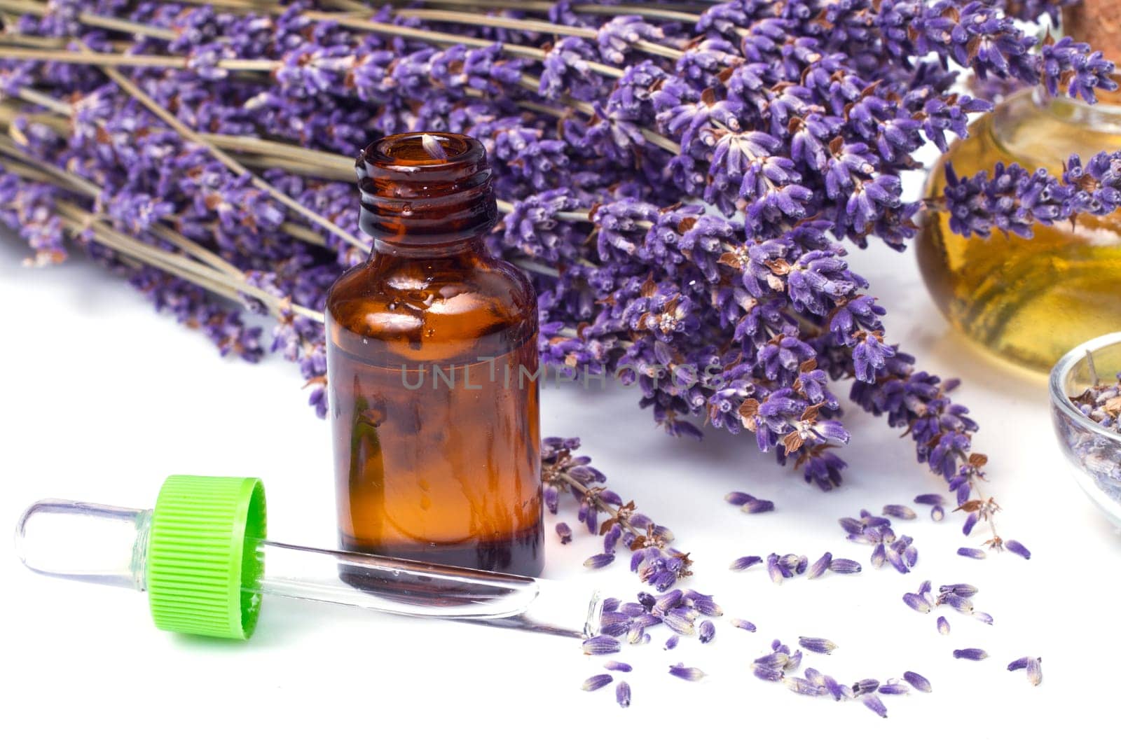 lavender flowers with oil  isolated on white background