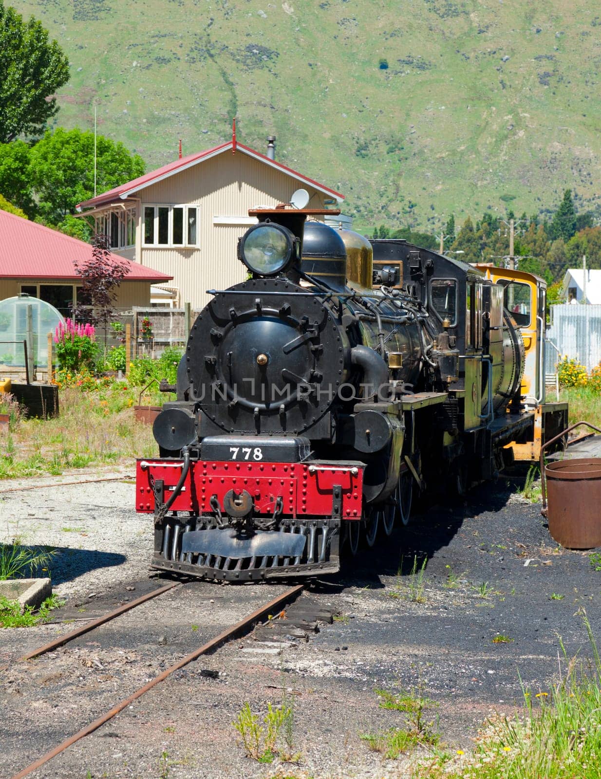 Old train engine perserved at a closed railway station in New Zealand