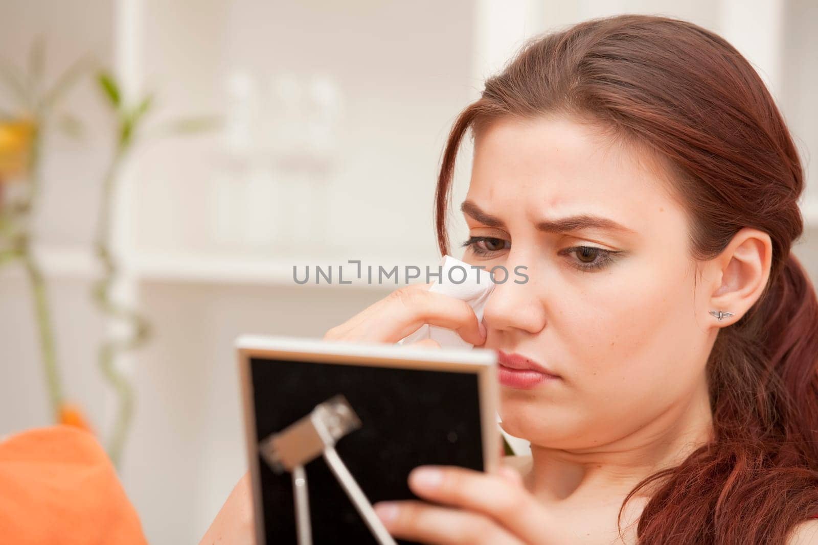 longing woman with handkerchief looking at frame