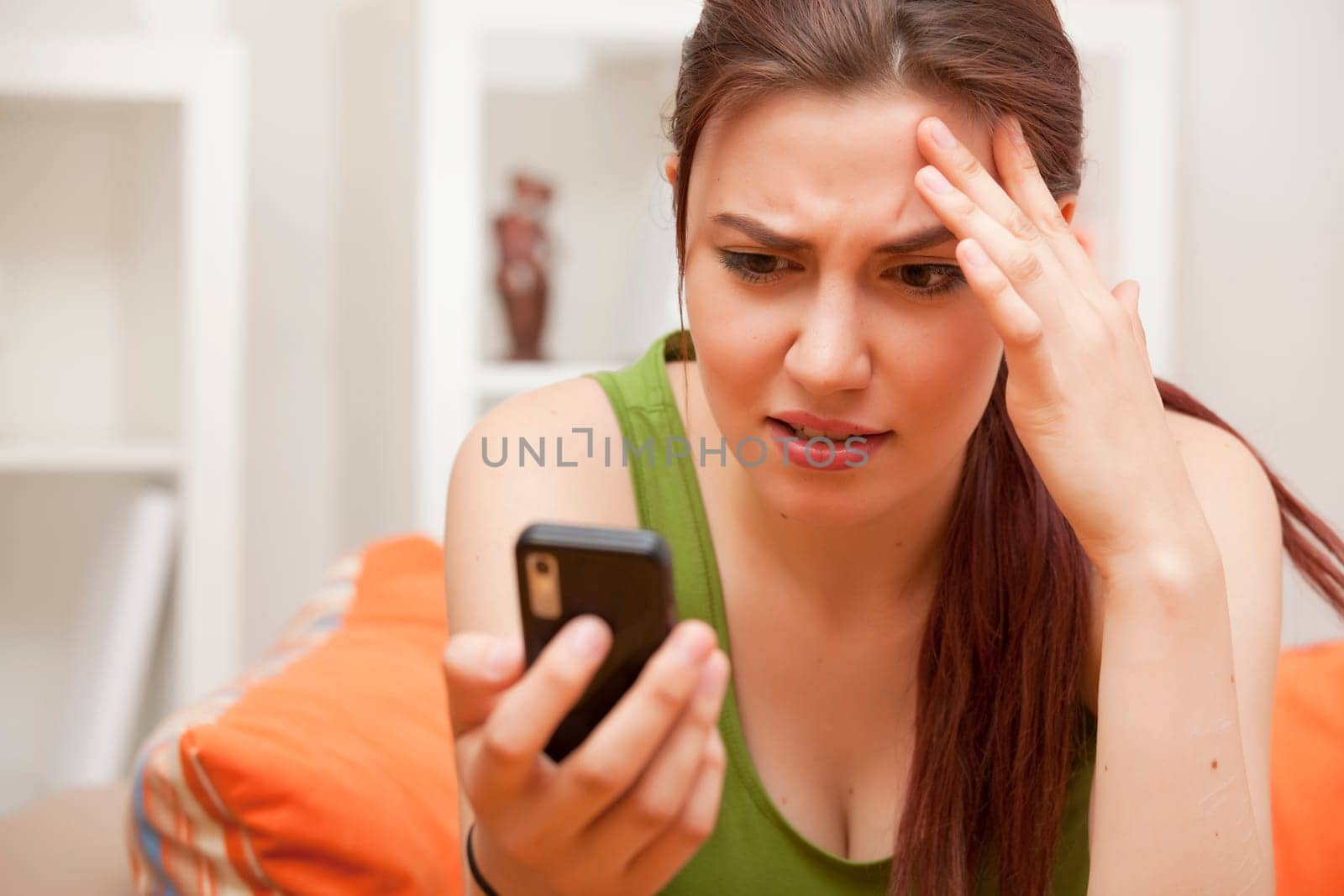shocked and frustrated woman with cellphone