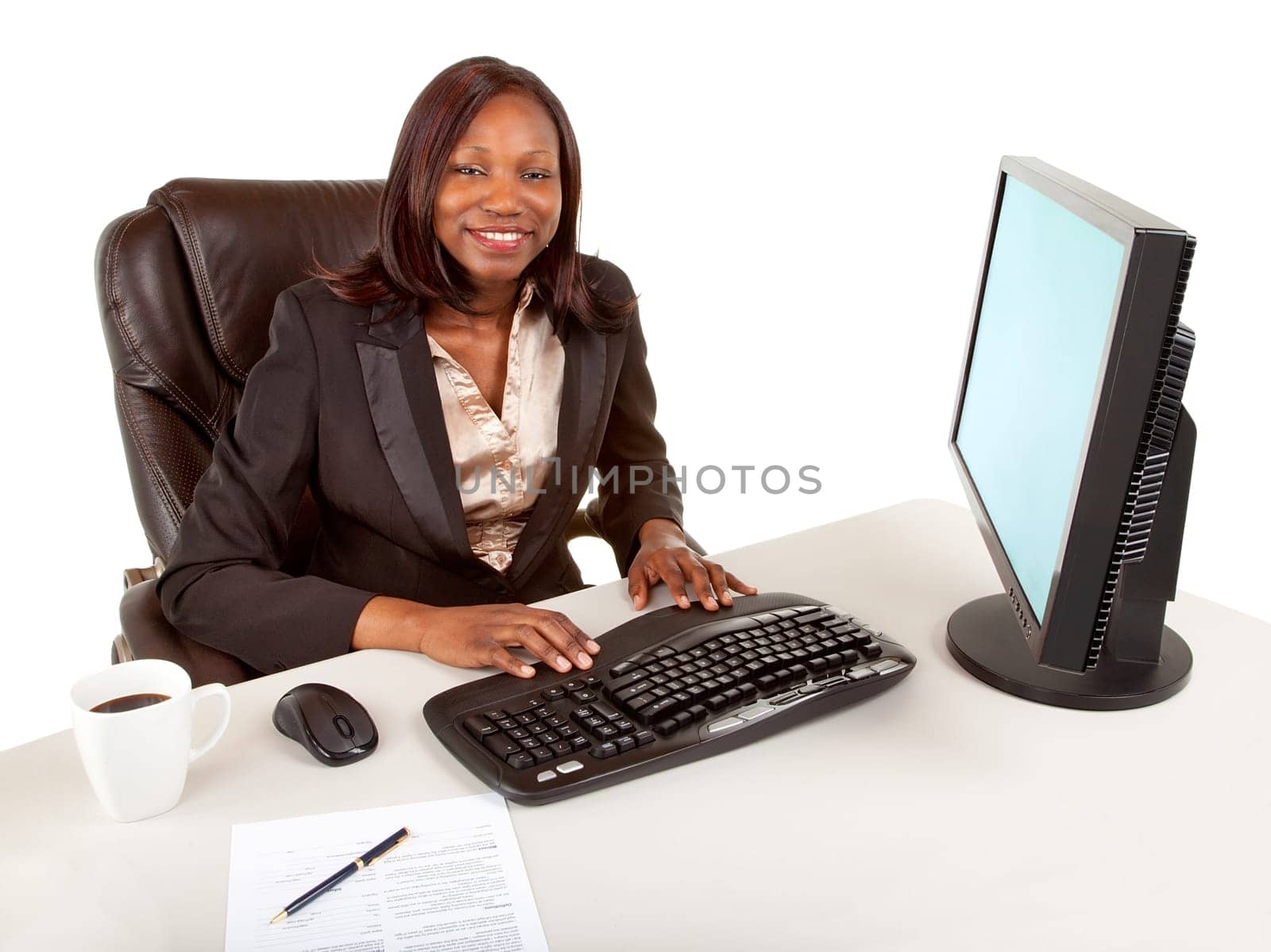 Smiling African American businesswoman working at her computer