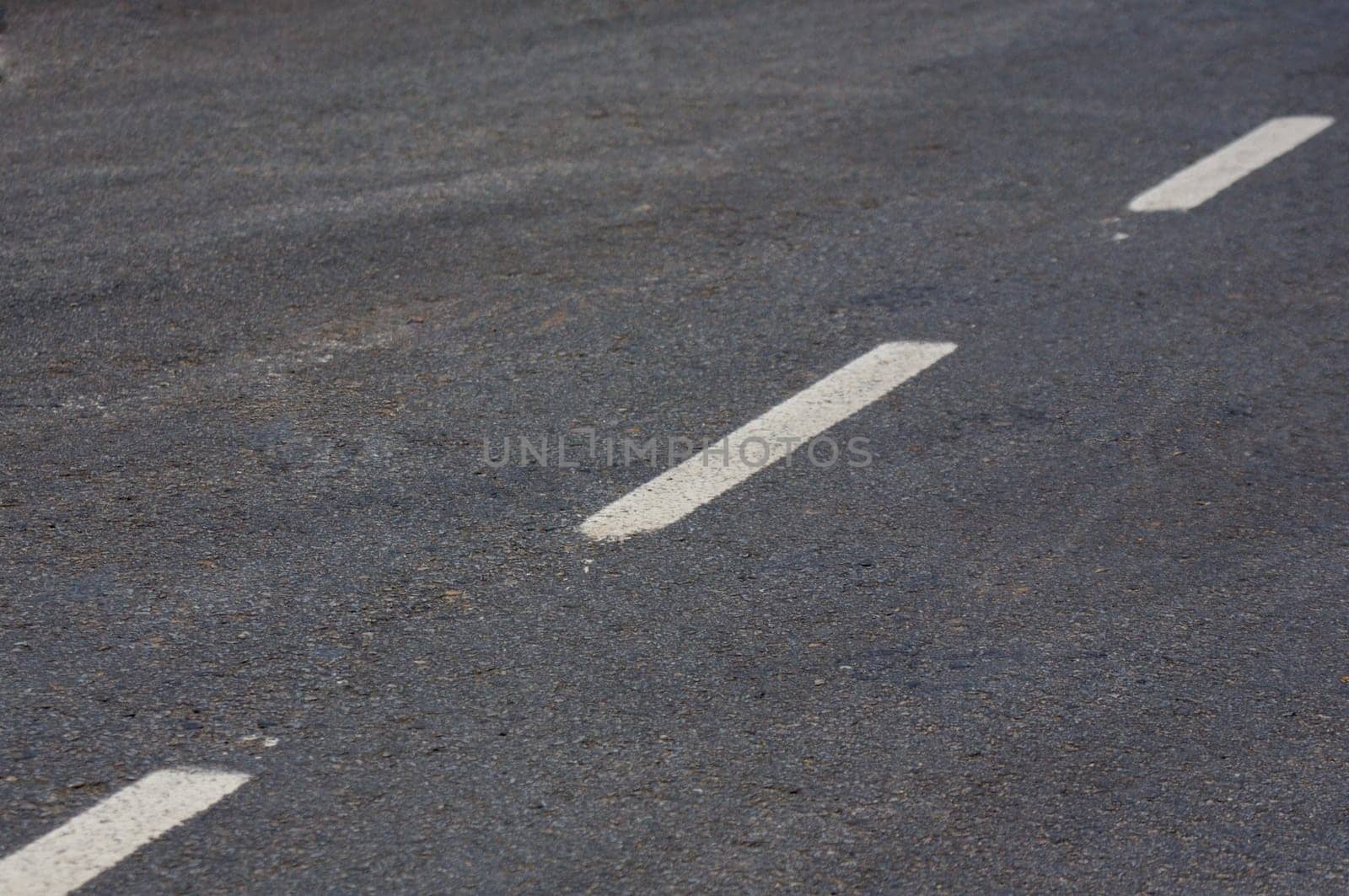 Road with white lines and asphalt texture
