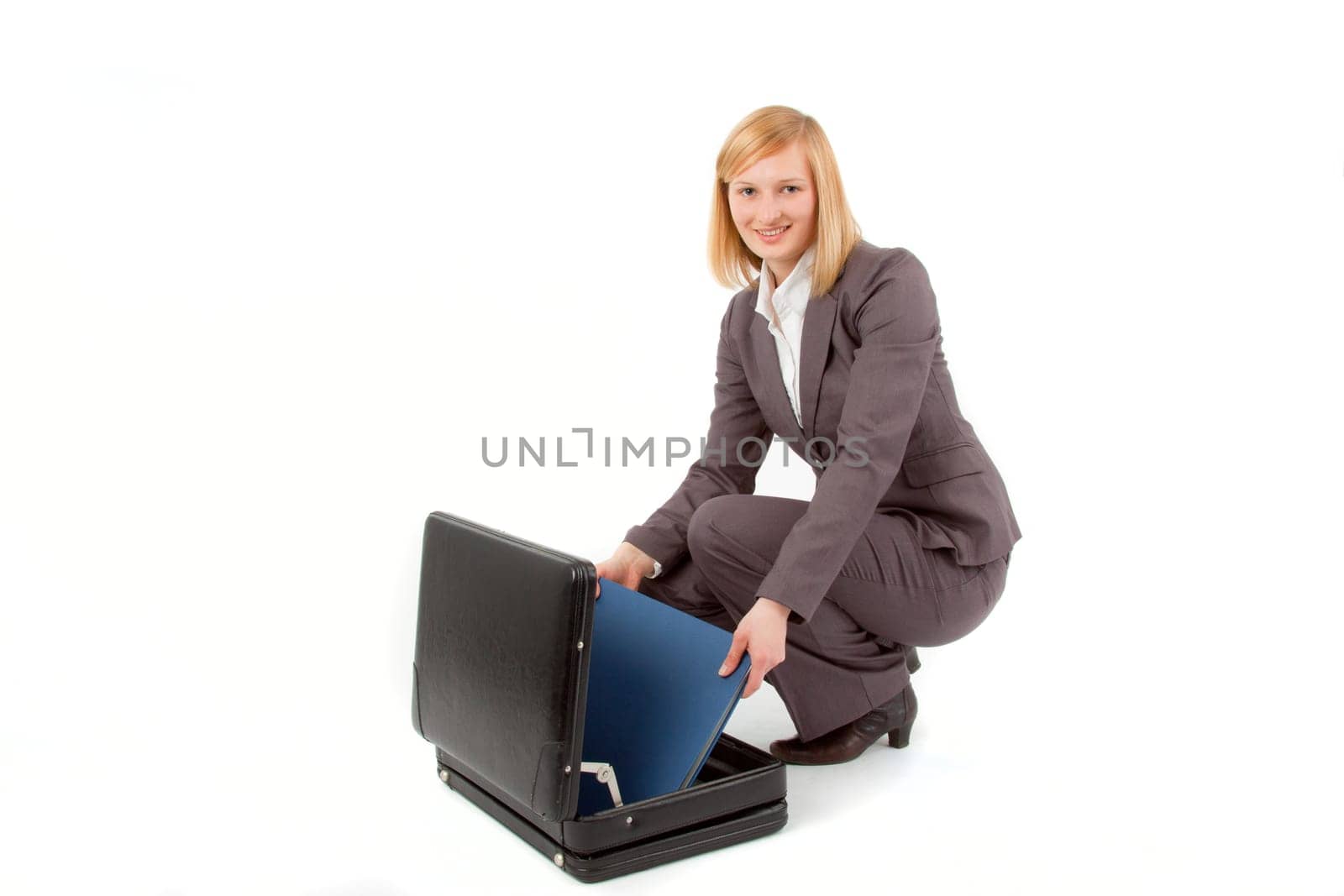Young woman with briefcase and folder