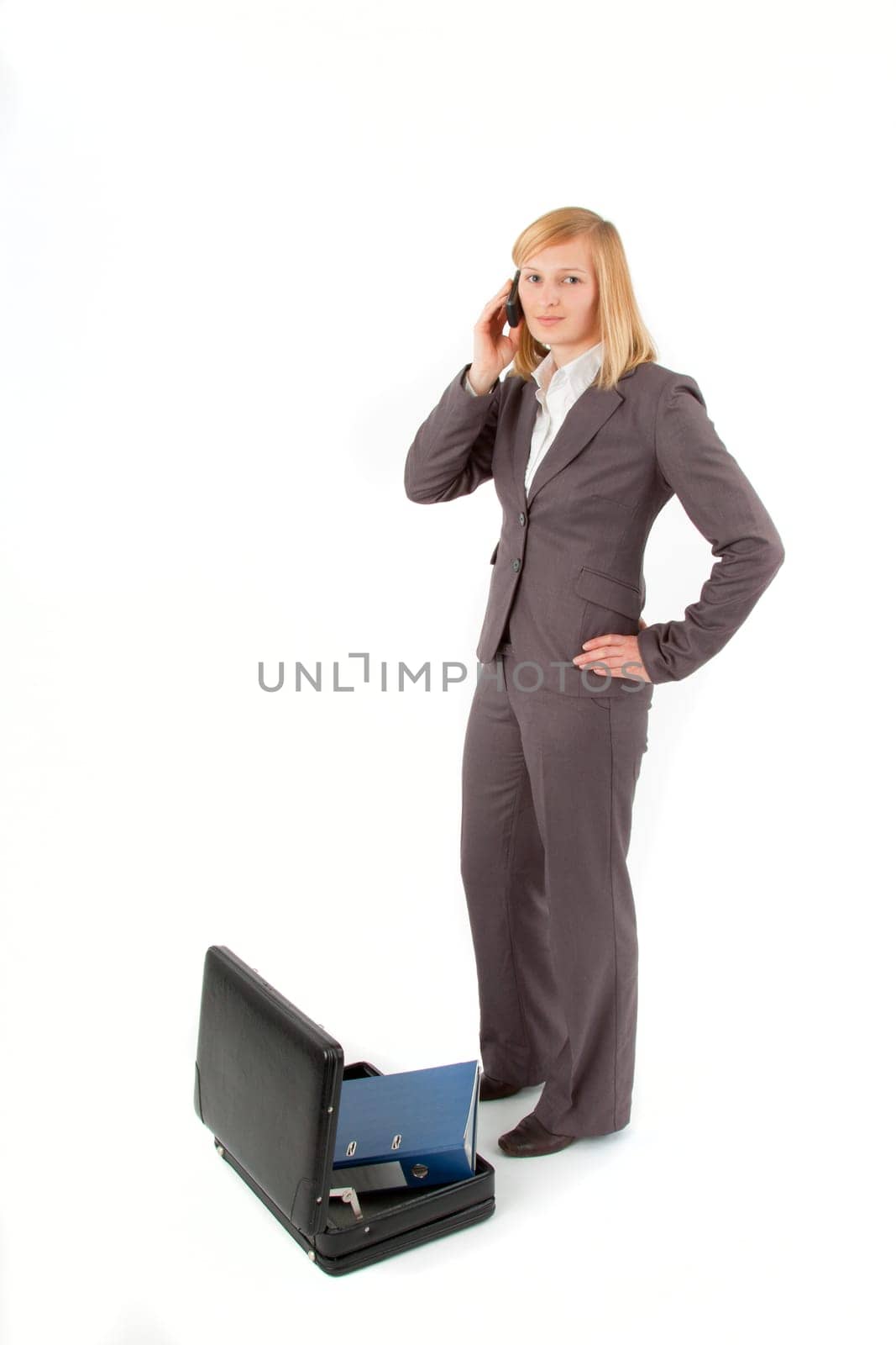 Young woman with briefcase and folder