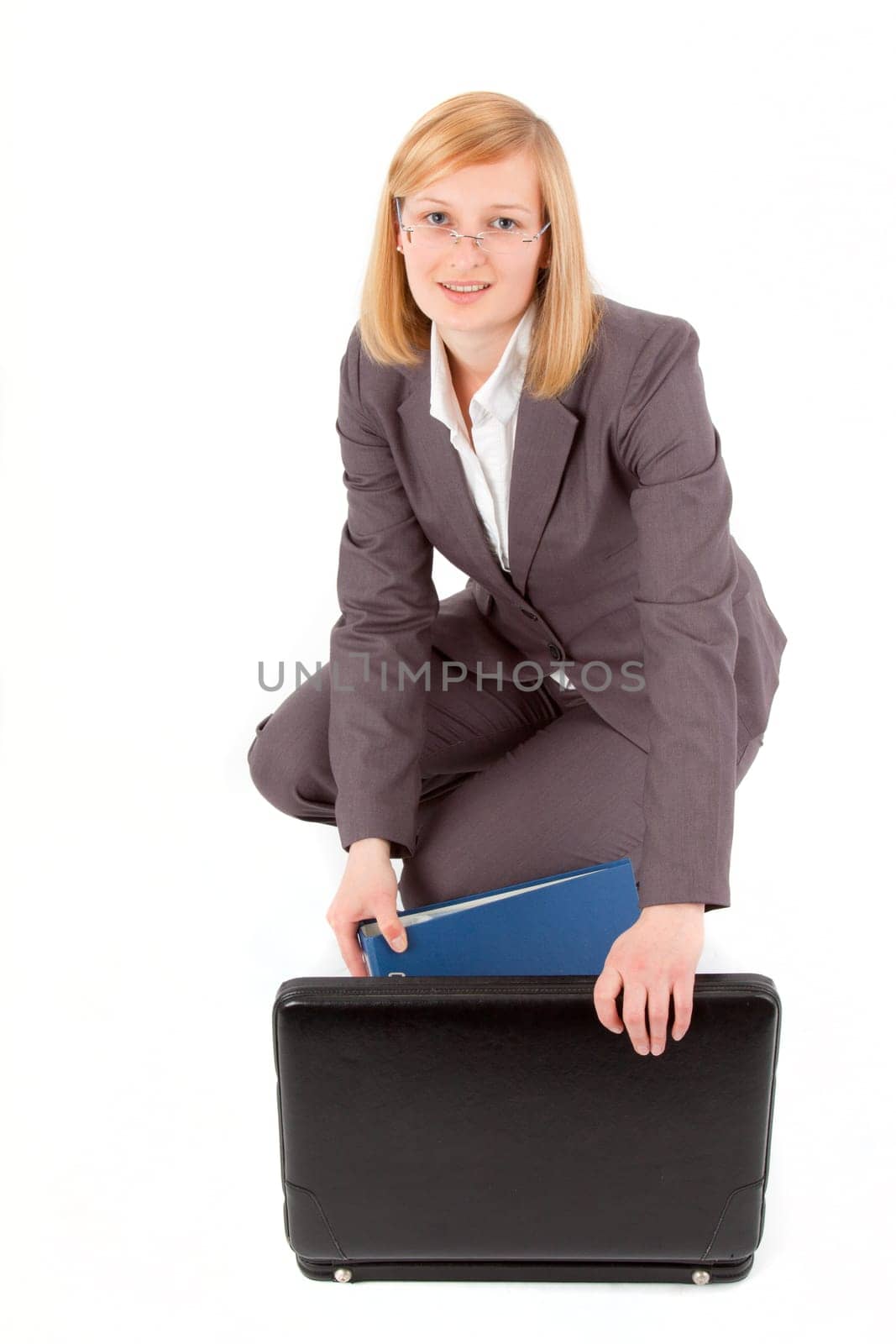 Young woman with briefcase and folder