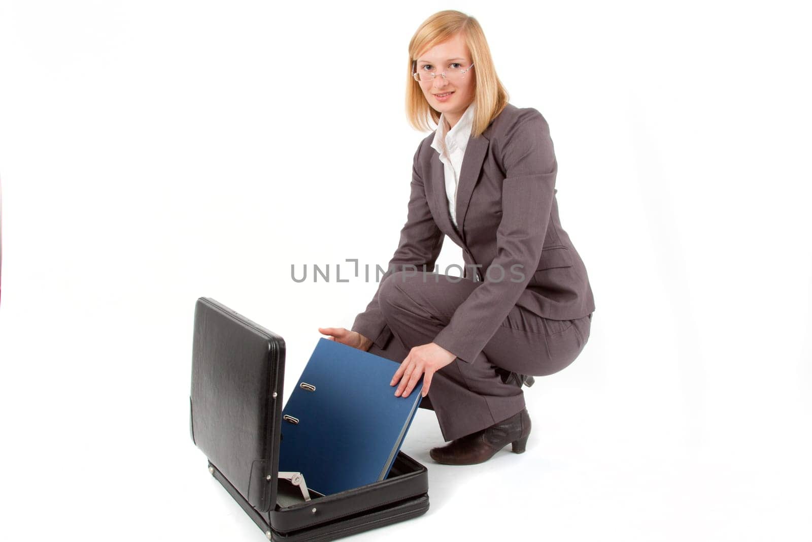 Young woman with briefcase and folder