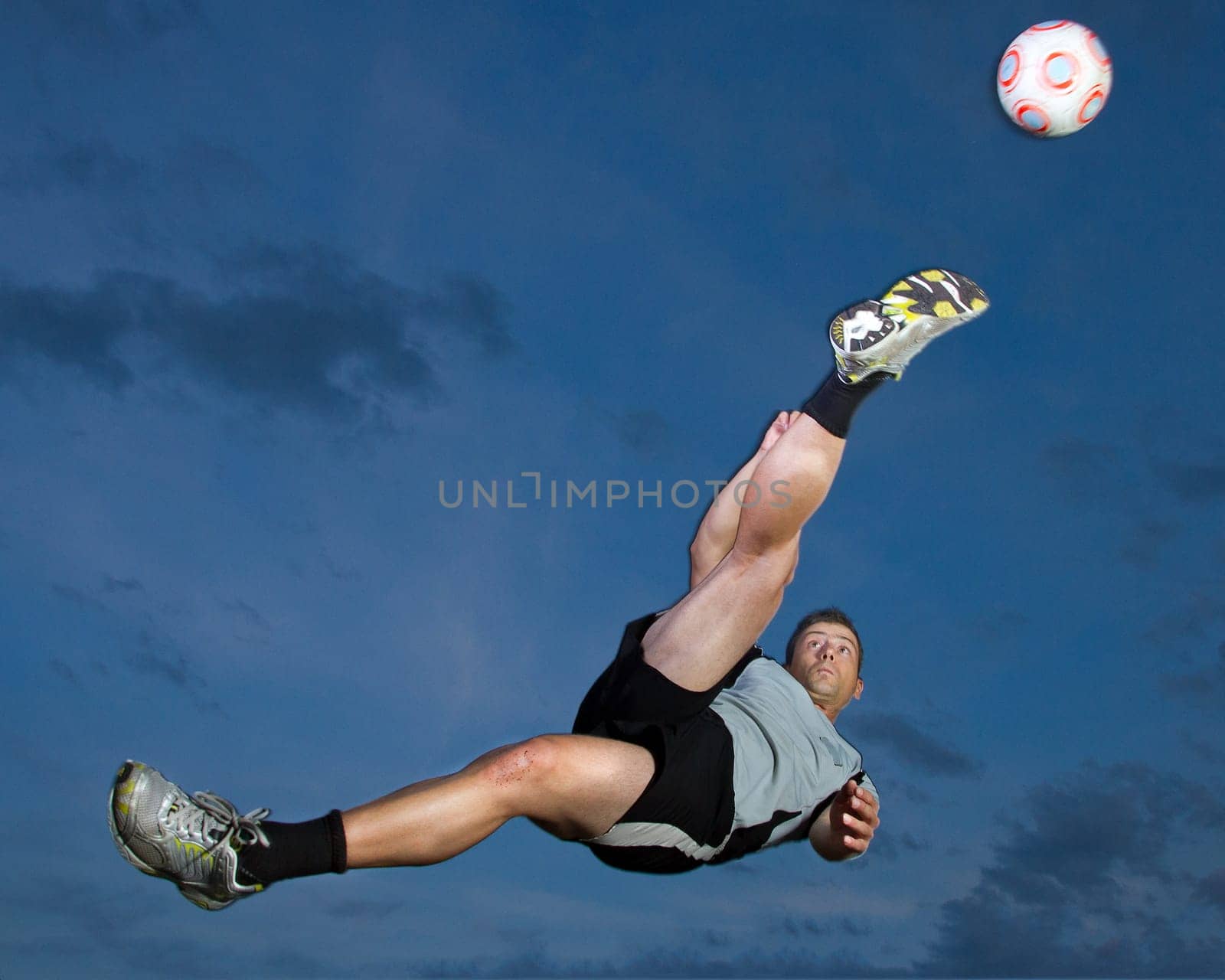 Footballers taking a overhead kick