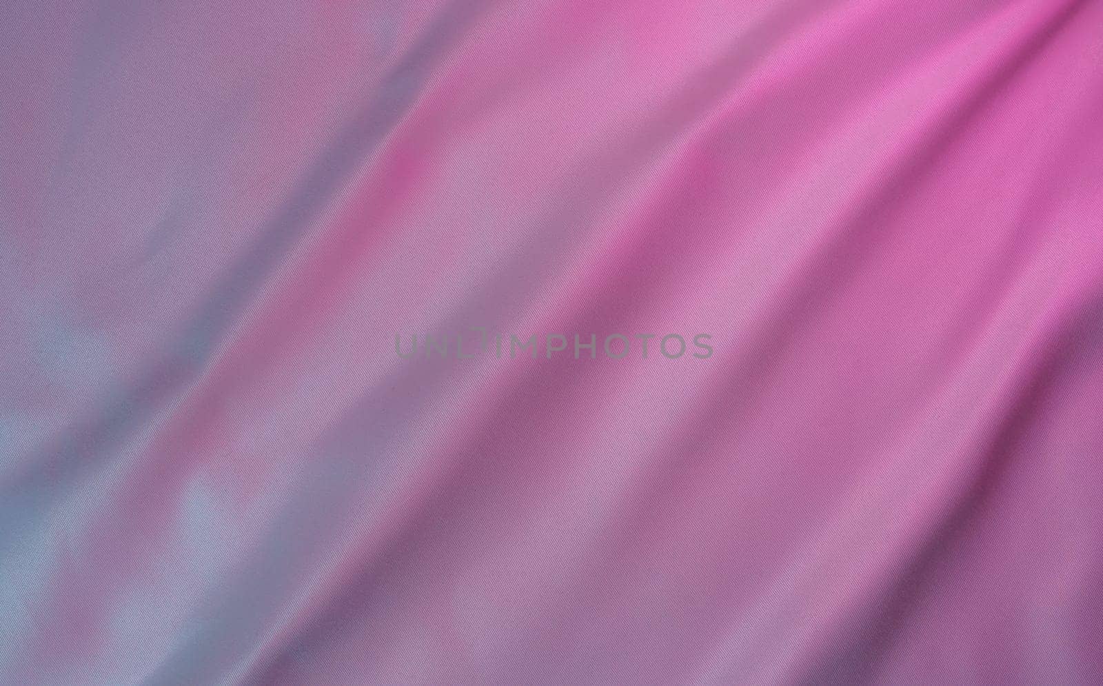 Fabric with a pink and purple gradient, featuring smooth folds and a soft texture. Perfect for backgrounds, templates, and modern design projects with copy space