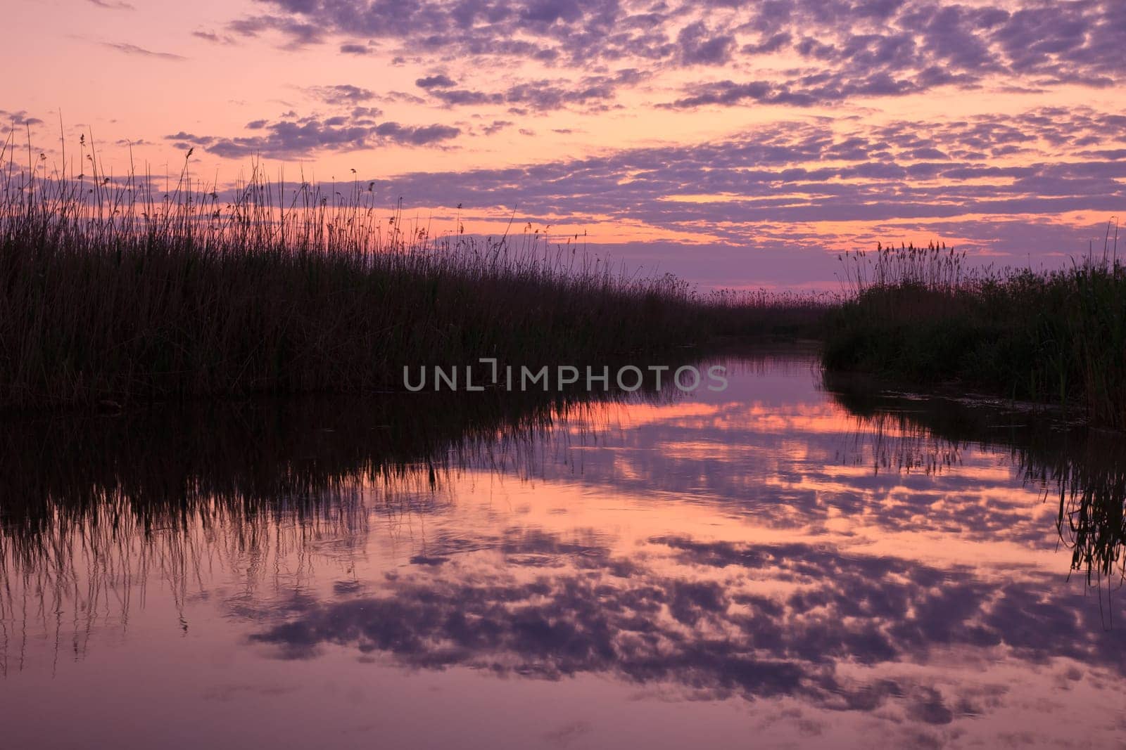 reflection of clouds on the lake at sunrise