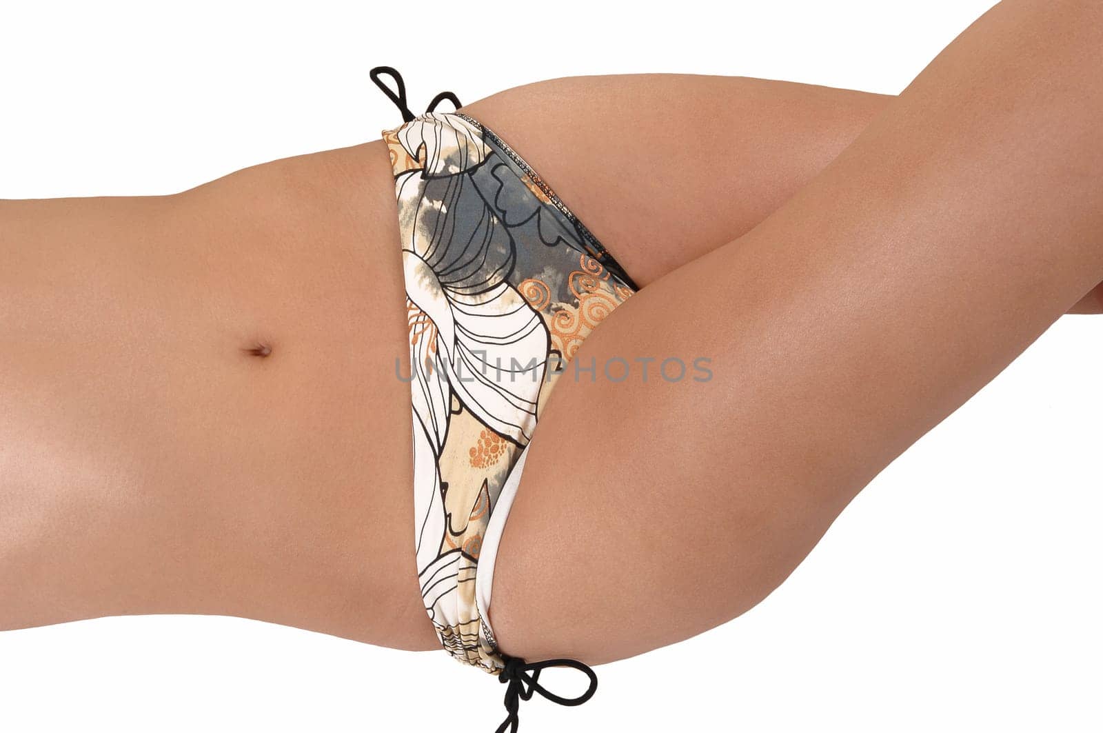 A lovely slim girl lying on the floor, a closeup of her bikini bottom with an gorgeous body, for white background.