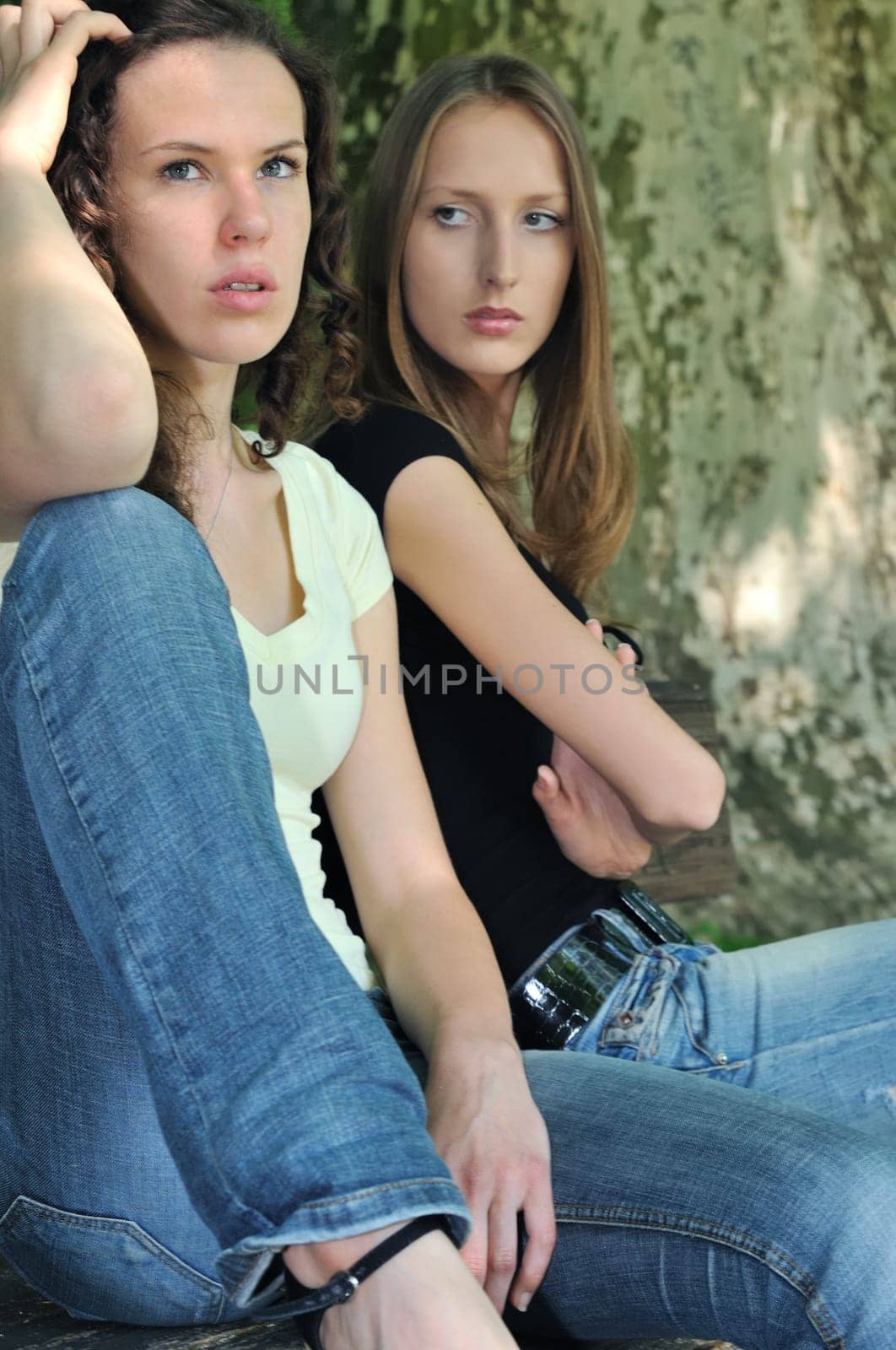 Friends outdoors series - two teenage girls are angry due to ther conflict
