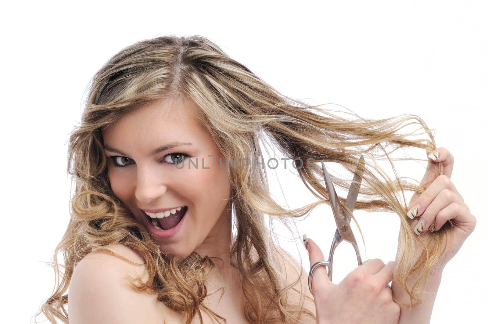 Young smiling beautiful woman cutting her hair with scissors isolated on white background