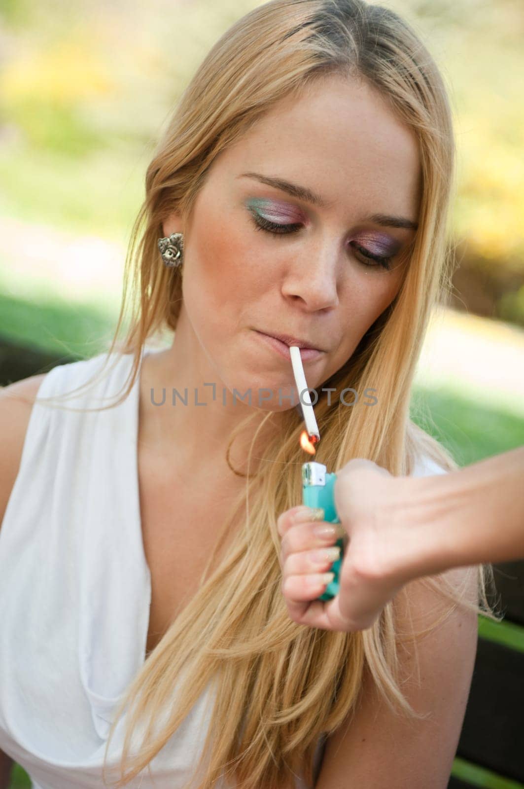 Smoking teenager - lighting cigarette