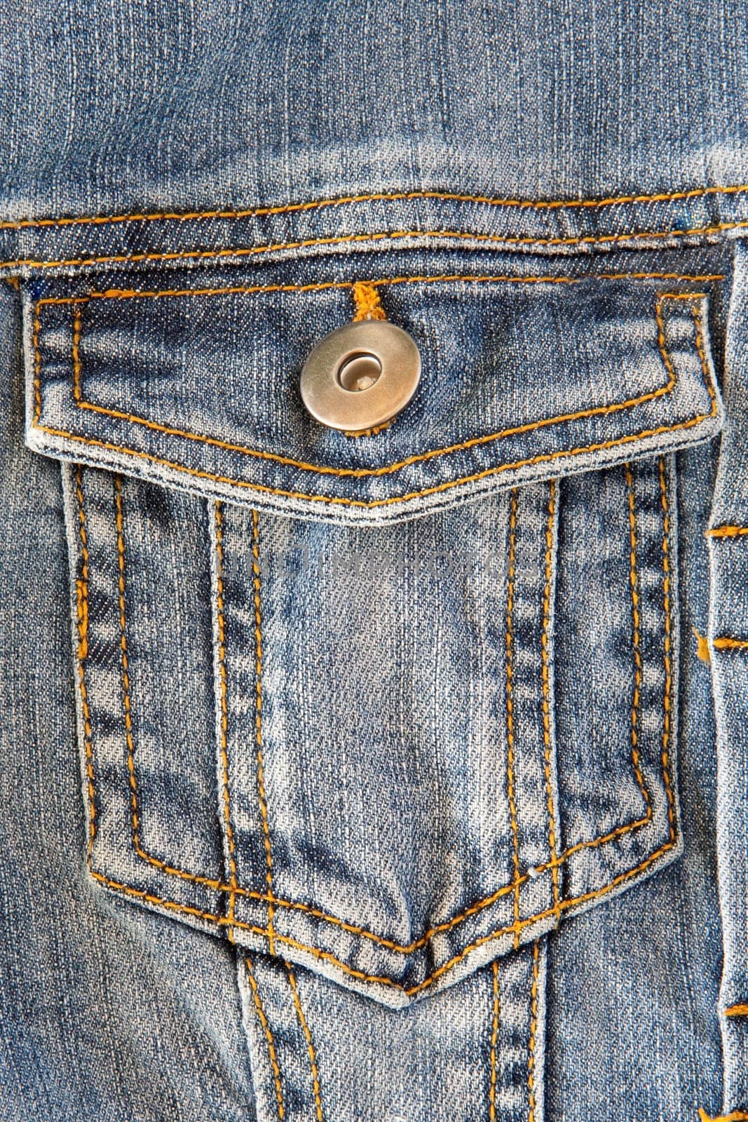 Photo of a pocket jeans with yellow thread