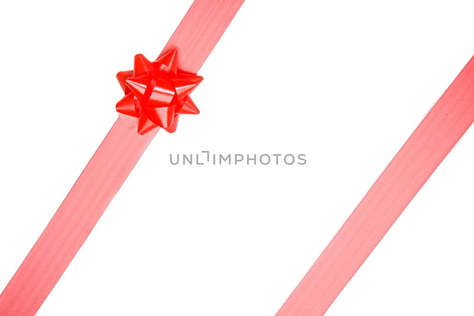 Red ribbon of gift on a over white background