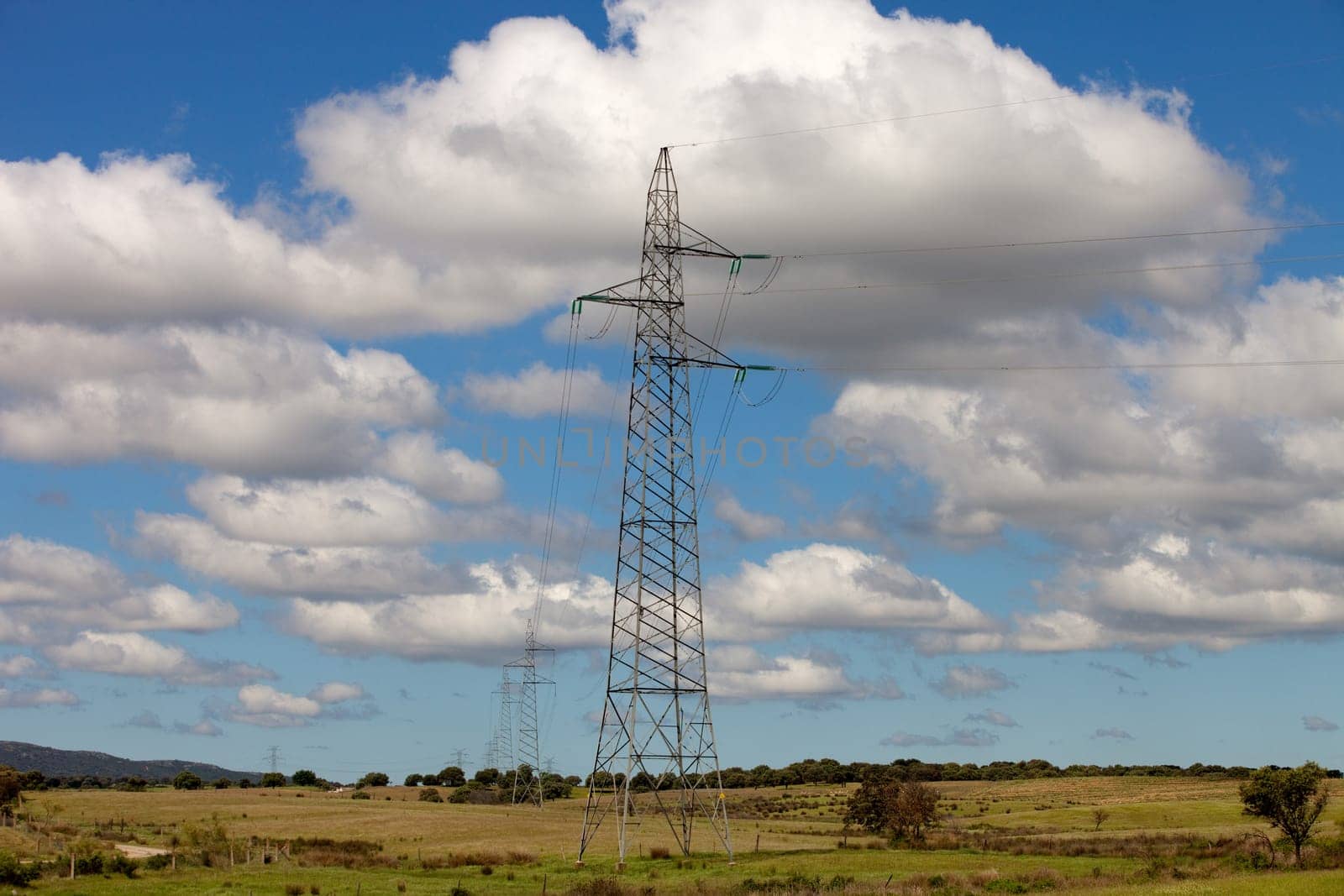 Power lines under a pretty blue sky