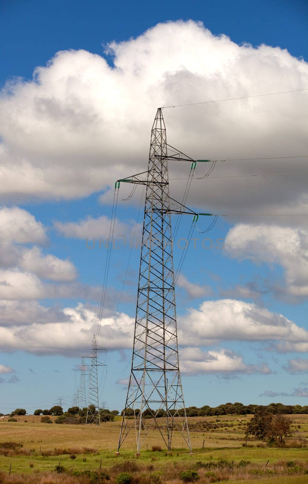Power lines under a pretty blue sky