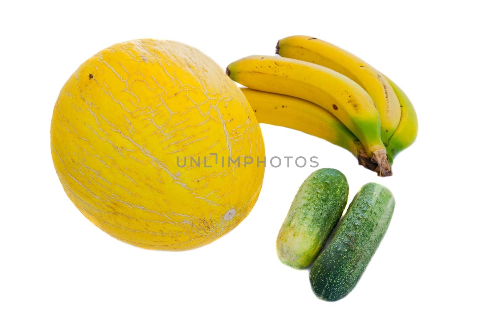 Melon yellow, two green cucumbers and bananas. Healthy Eating